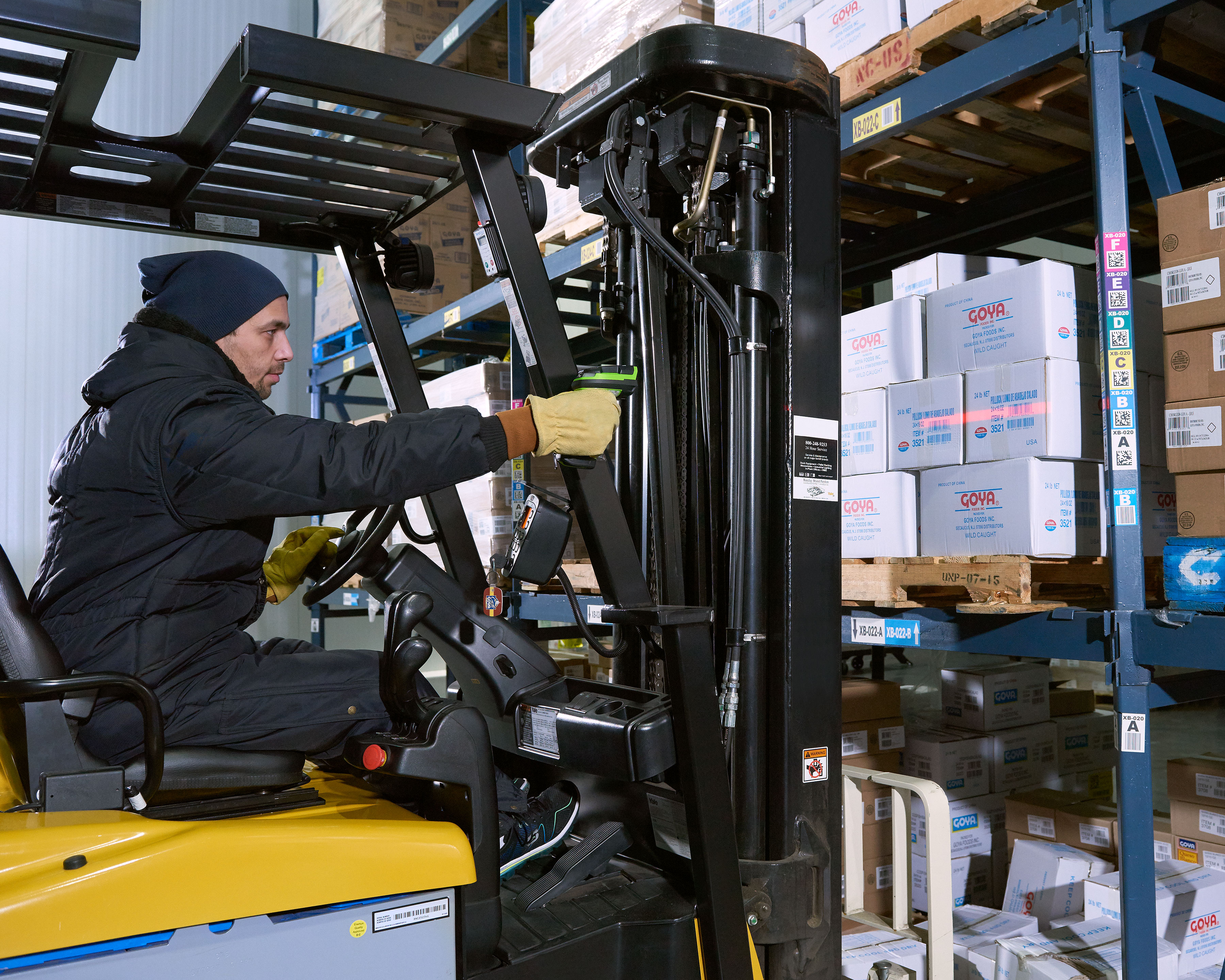 Worker uses Zebra LI3600 barcode scanner in a warehouse freezer