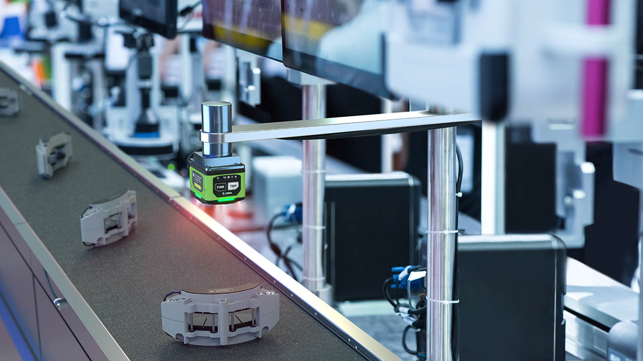 A machine vision camera inspects components on the manufacturing line