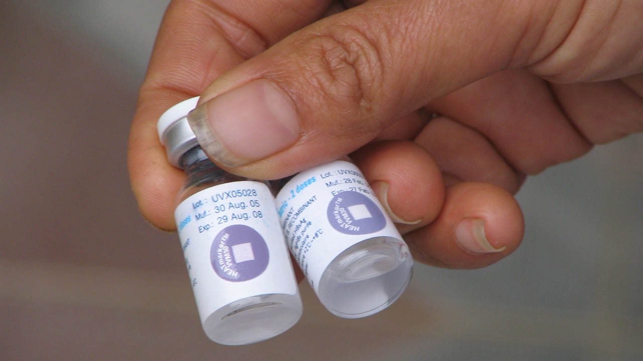 A Temptime heat indicator can be seen on two vaccine vials,