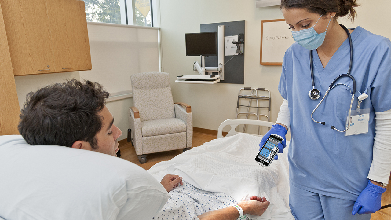 A nurse uses the new TC52x-HC is used to scan a patient's wristband