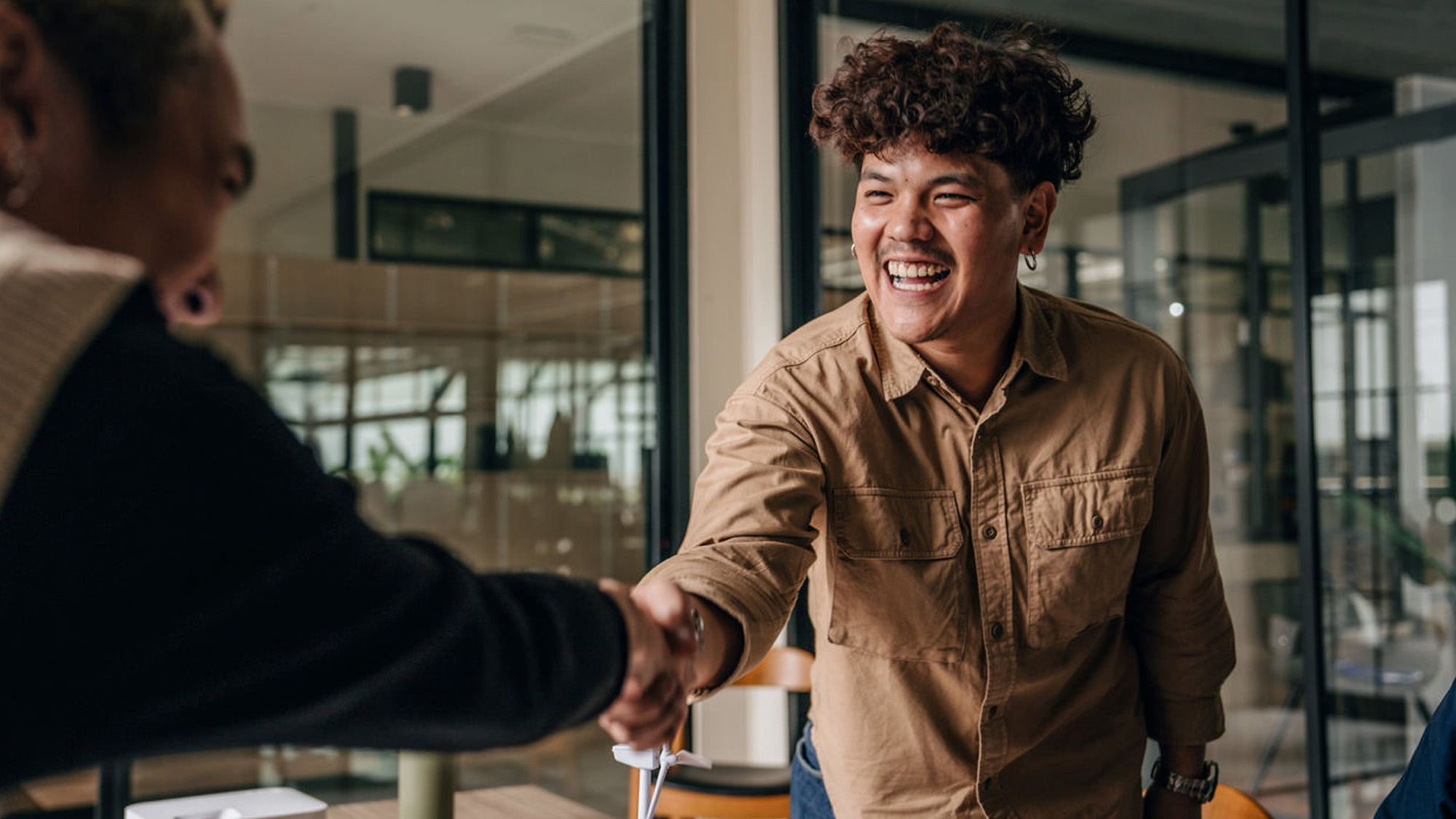 Photo of meeting and handshake at a business office