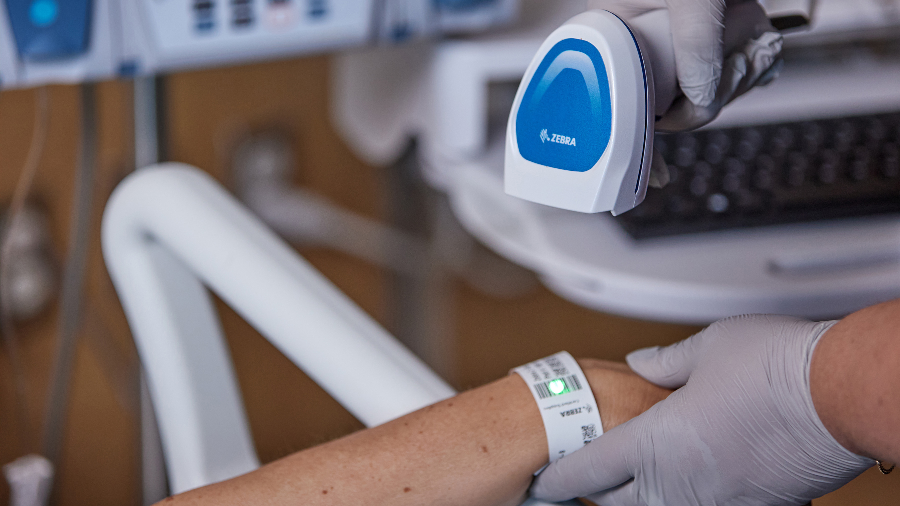 Zebra barcode scanner being used on medical ID bracelet