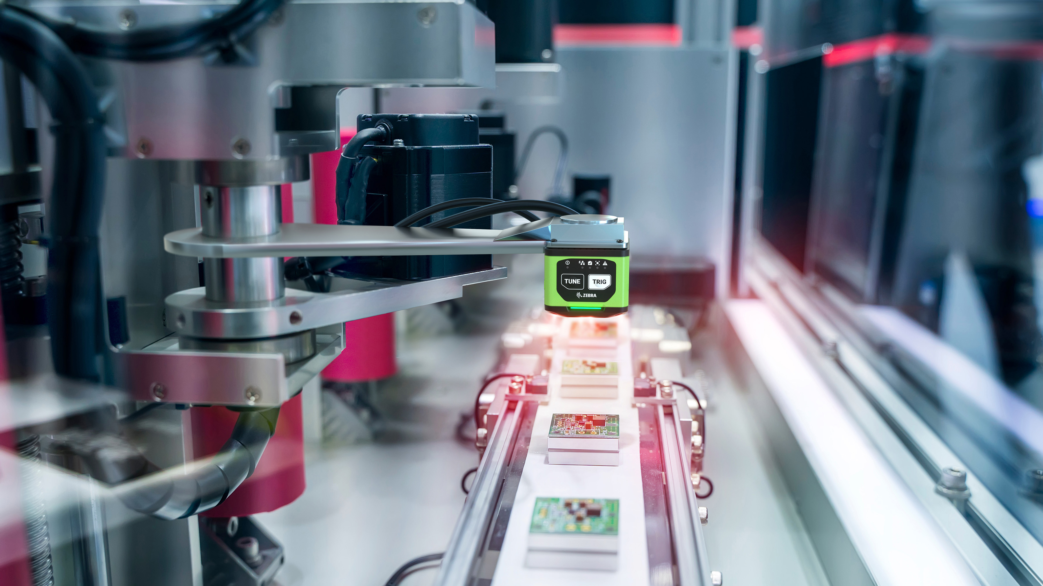 FS40 industrial smart camera performing AOI of printed circuit boards moving along a conveyor in an electronics production line. Image highlights real-time defect detection, component verification, and high-speed quality control.