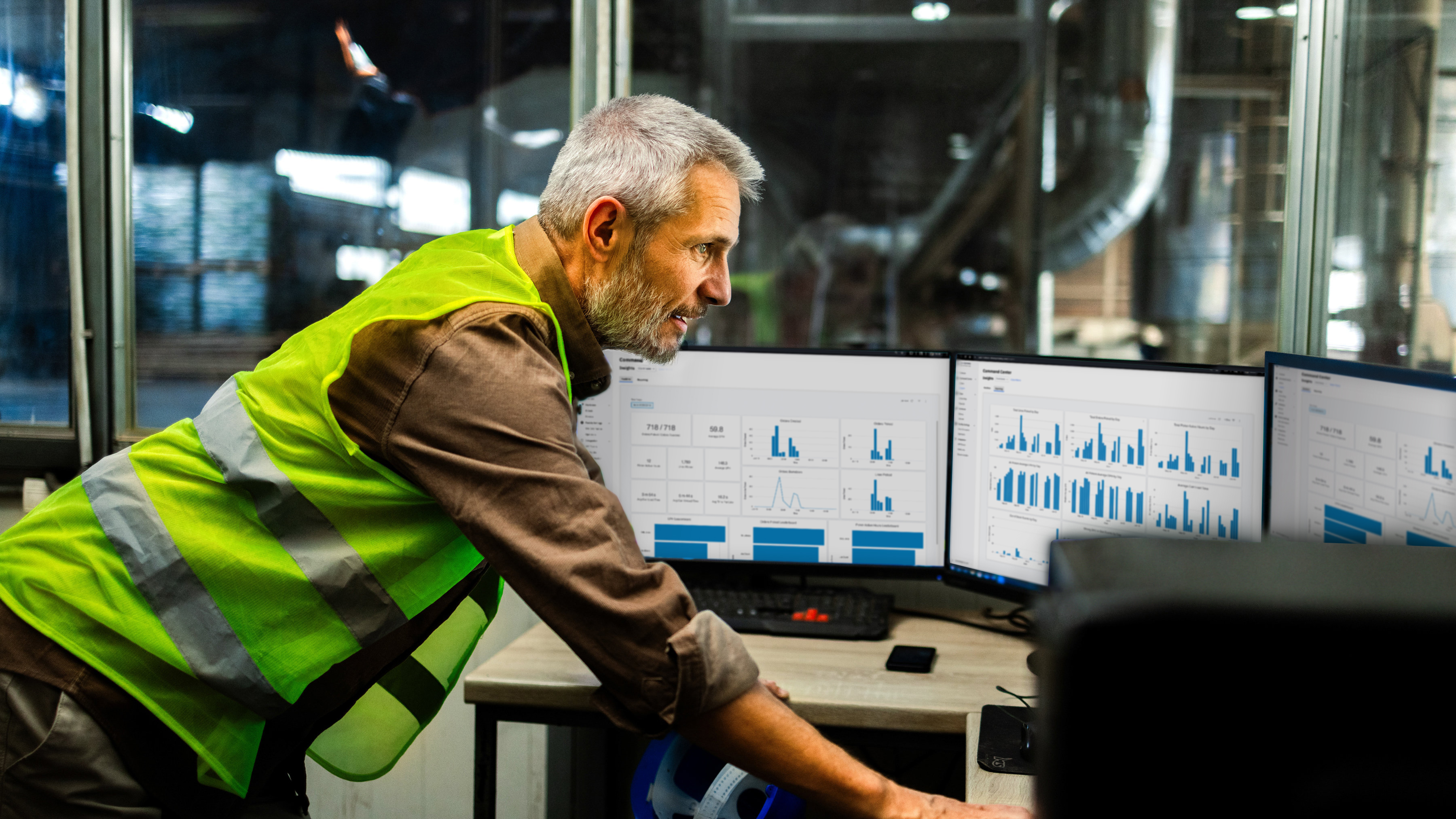 Image of facility manager reviewing the Symmetry software command center analytics