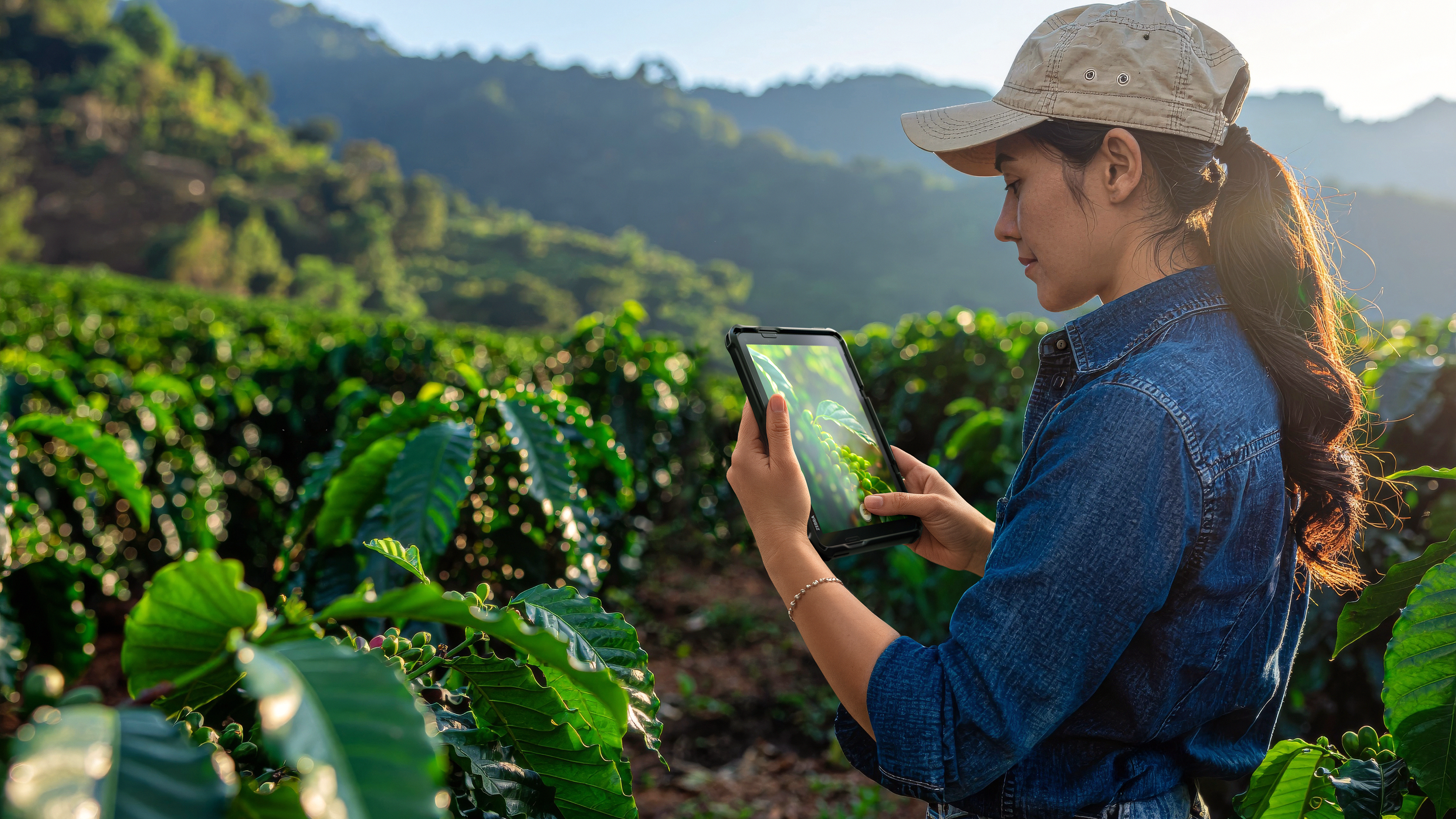 Field operations worker using an ET401 8 inch tablet, doing an inspection in agriculture by taking a photo.This image was generated with the assistance of AI tools and may not depict real people, places, or events.