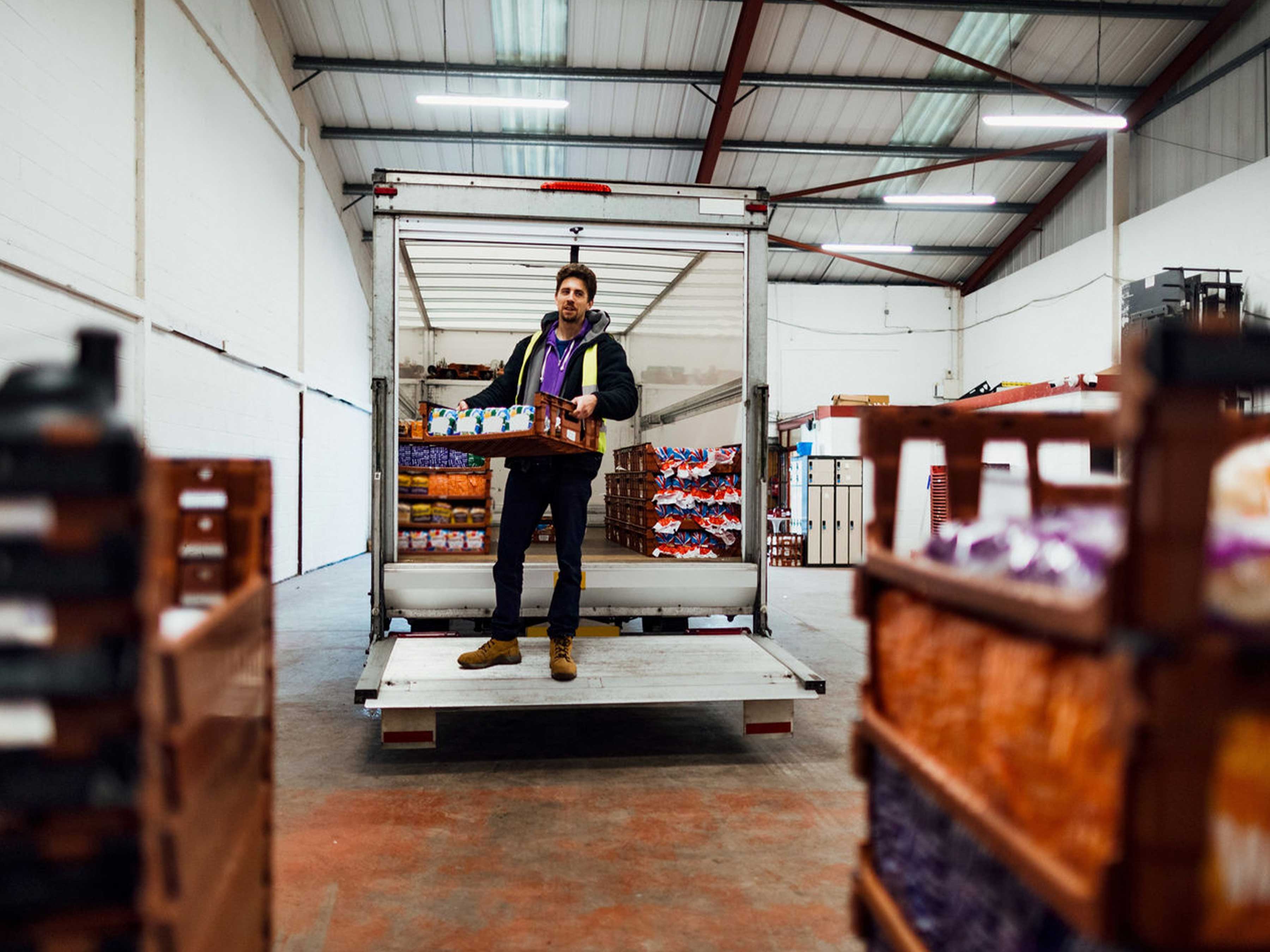 Delivery truck unloading in store room