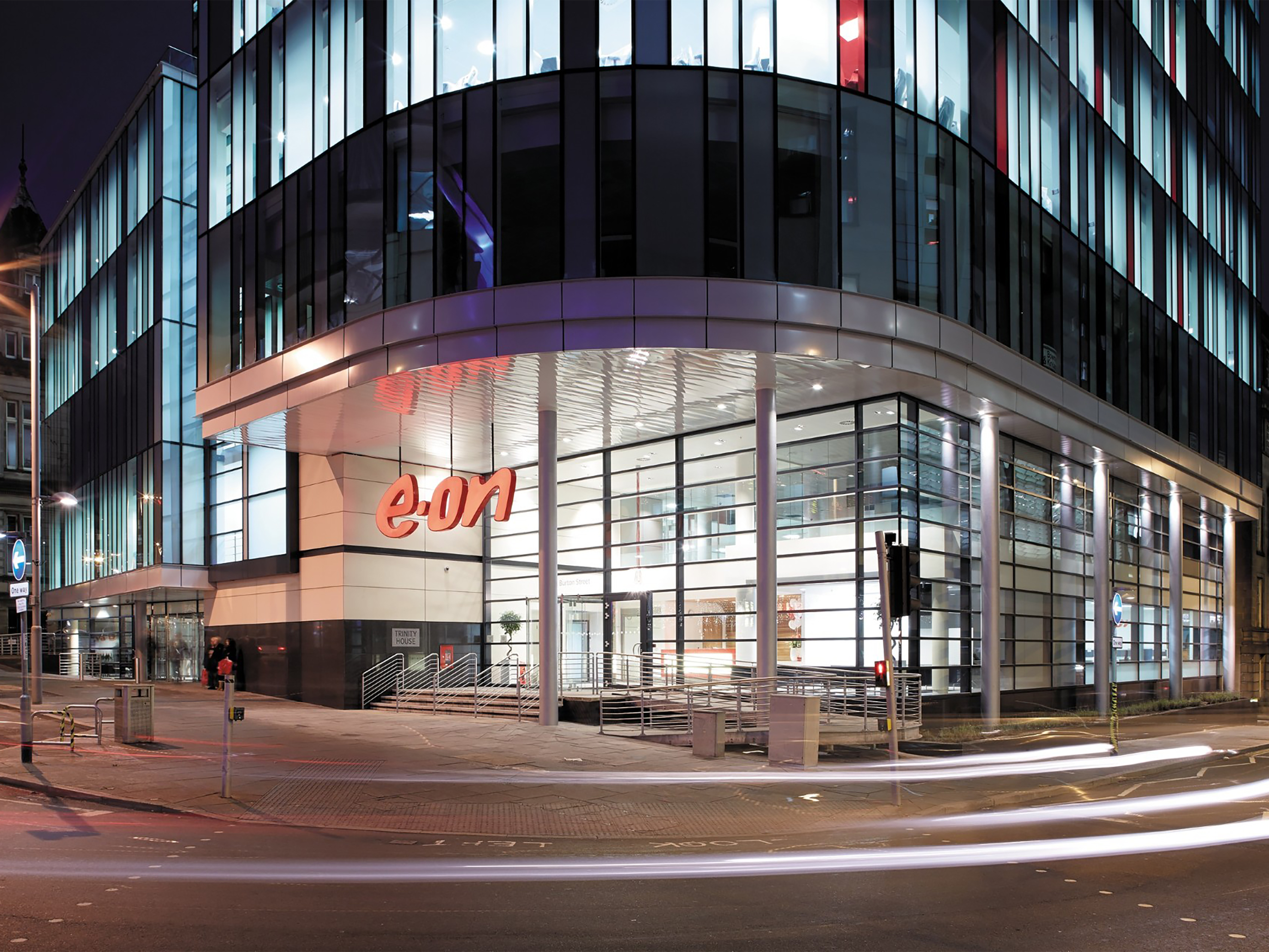 The outside of an E.ON building at nighttime.