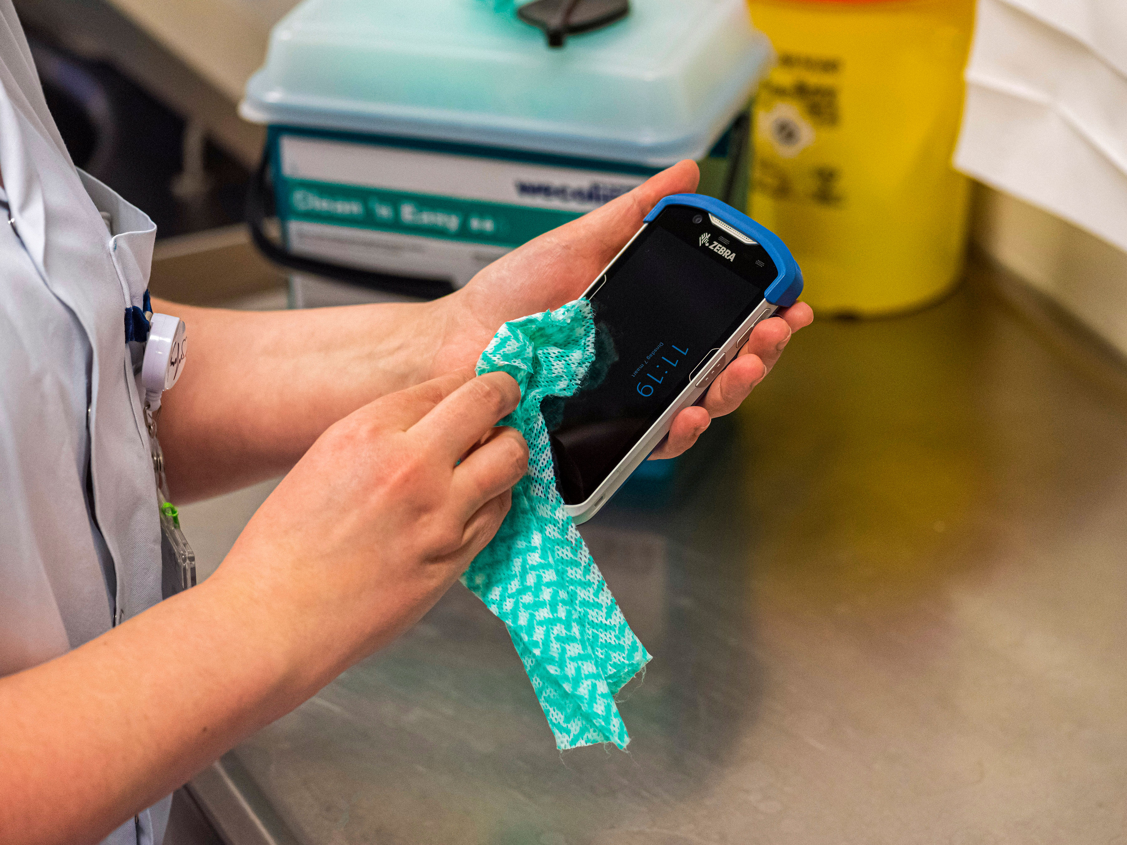 Nurse cleaning zebra device