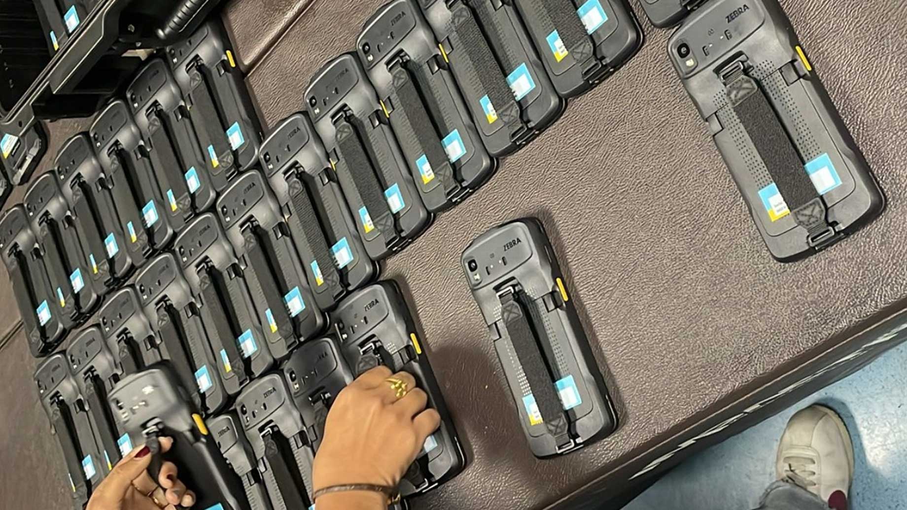 Zebra's handheld barcode scanners arranged on a PouchNATION table