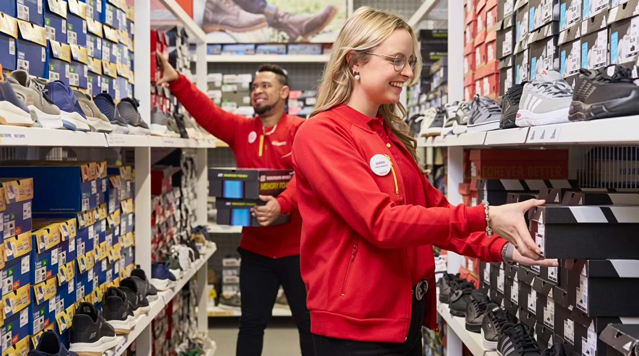 Scapino retail employees organizing shoe store shelves