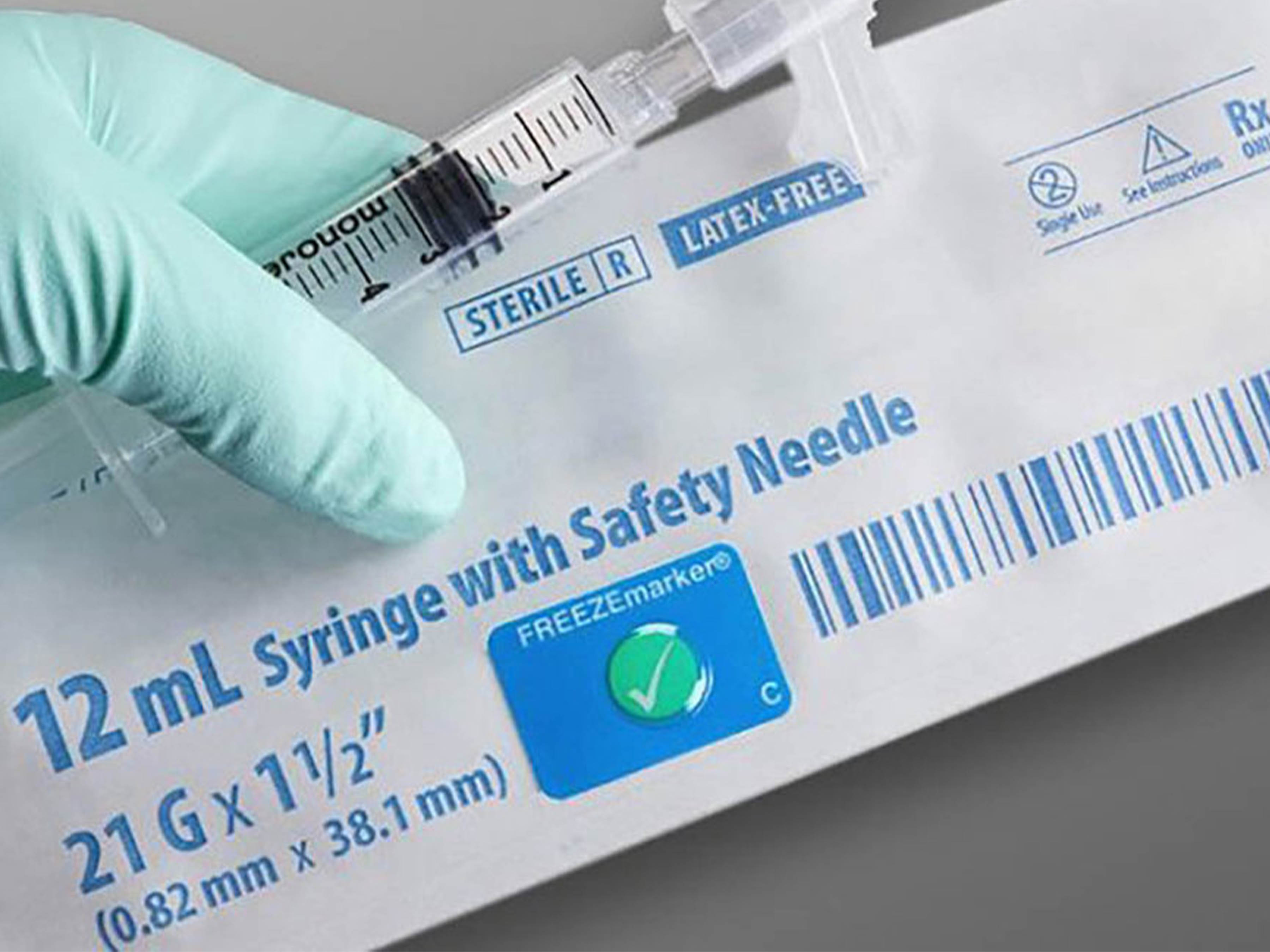 A Zebra Freezemarker temperature monitoring sensor applied to a package, demonstrating its application in cold chain logistics and temperature-sensitive shipping.