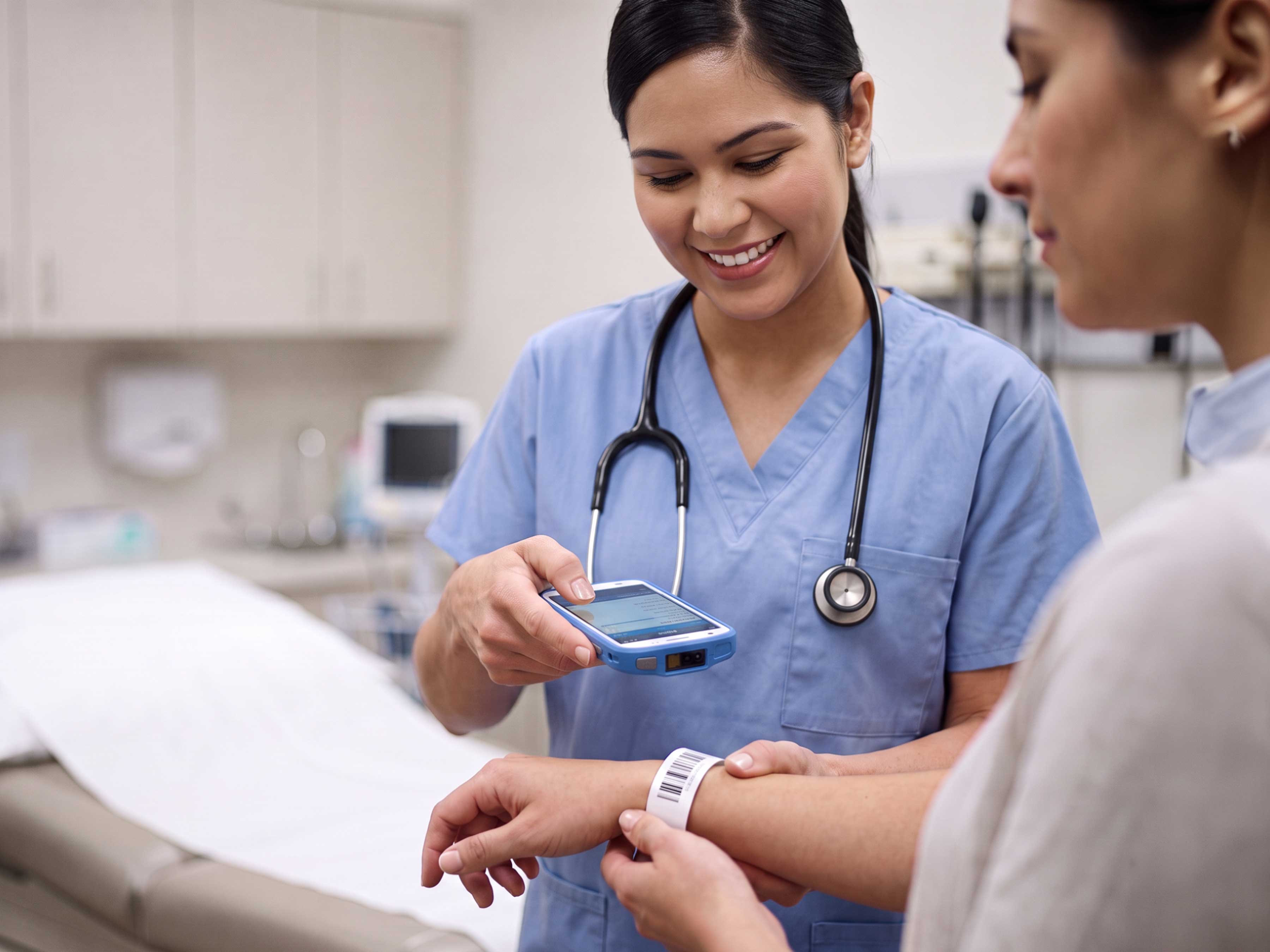 A healthcare professional uses a Zebra HC50 mobile computer to scan a patient's wristband for accurate identification at the point of care.