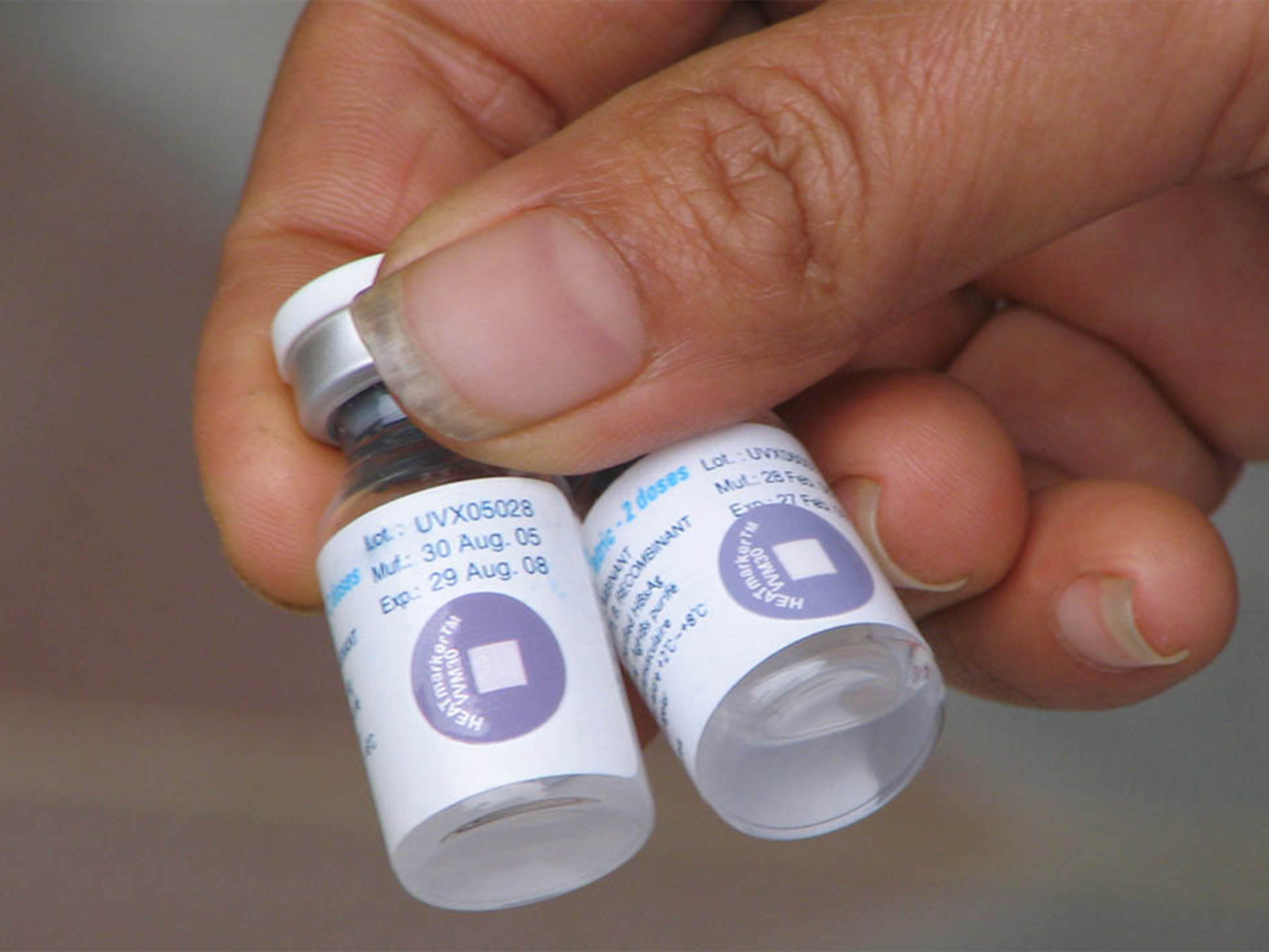 Two vaccine vials equipped with Temptime Heatmarker VVM (Vaccine Vial Monitor) temperature indicators, showing how the sensory indicators monitor heat exposure at the point of use to ensure vaccine efficacy.