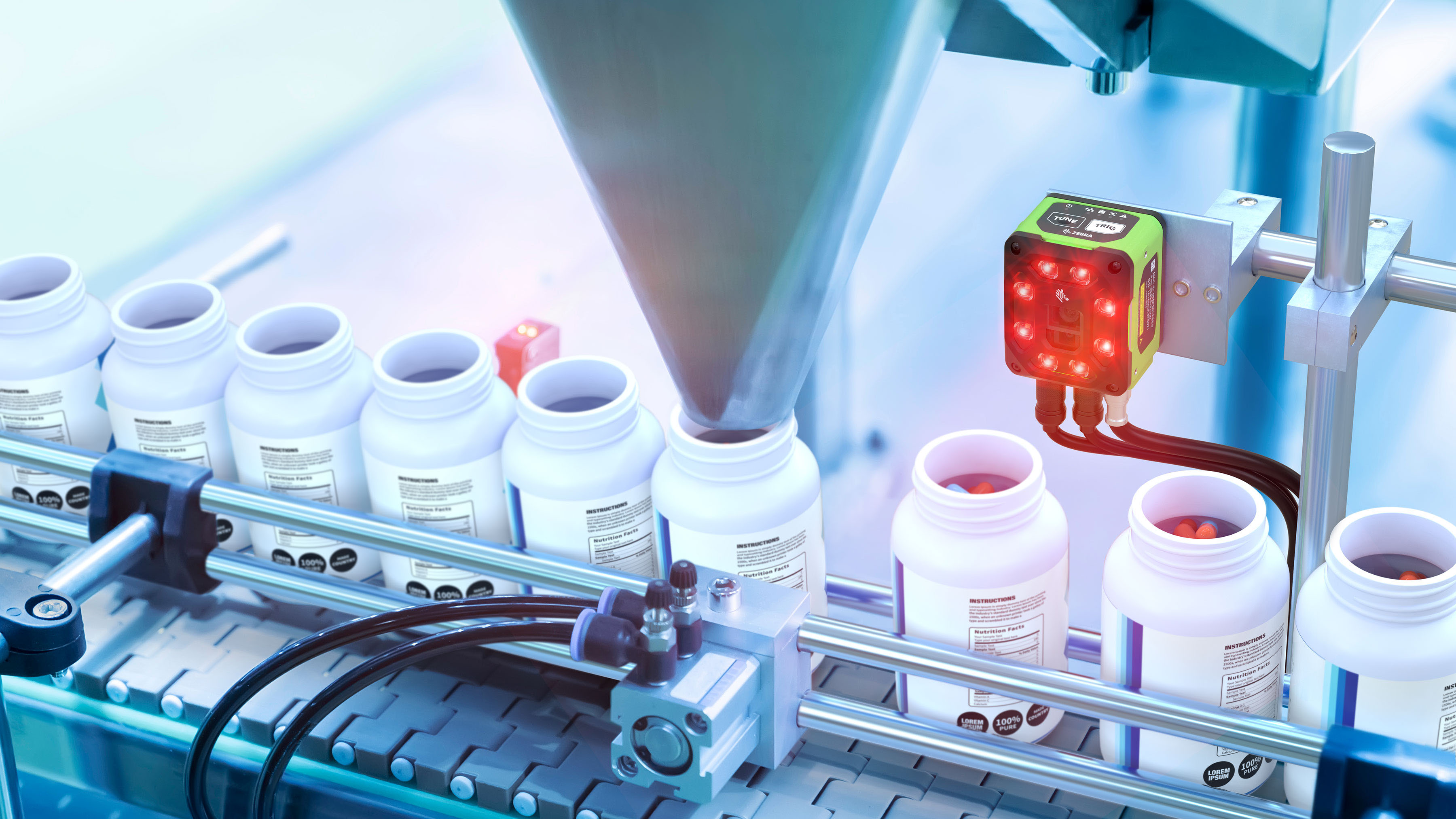 A Zebra VS40 Machine Vision Smart Camera using deep learning-based OCR is scanning and helping verify labels on a conveyor belt in a pharmaceutical packaging production line.