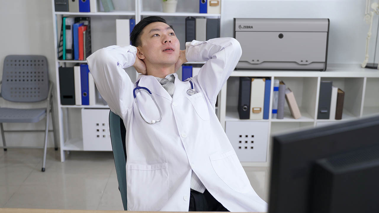 A healthcare provider rests in a break room