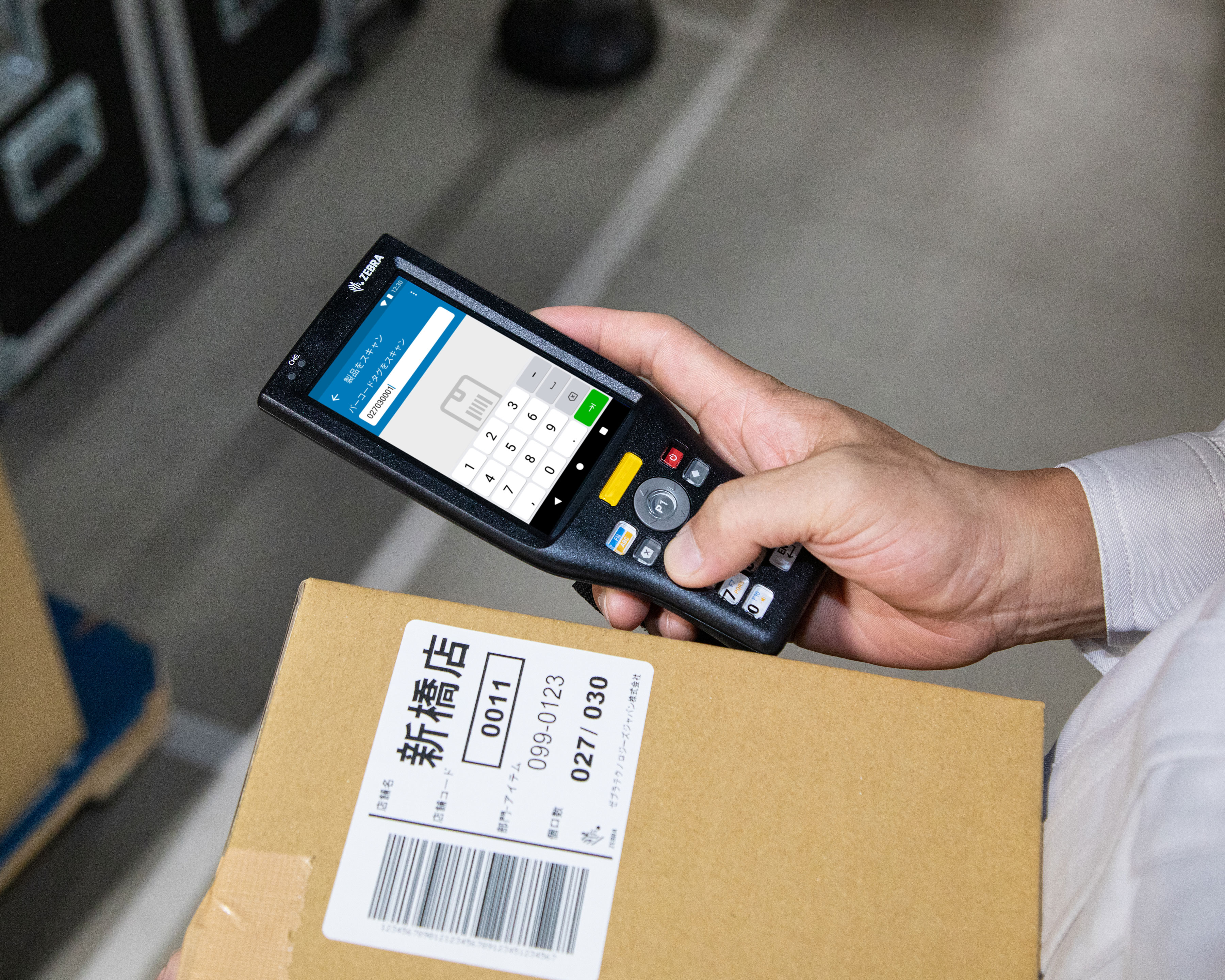 Warehouse worker uses Zebra MC20 mobile computer for box verification