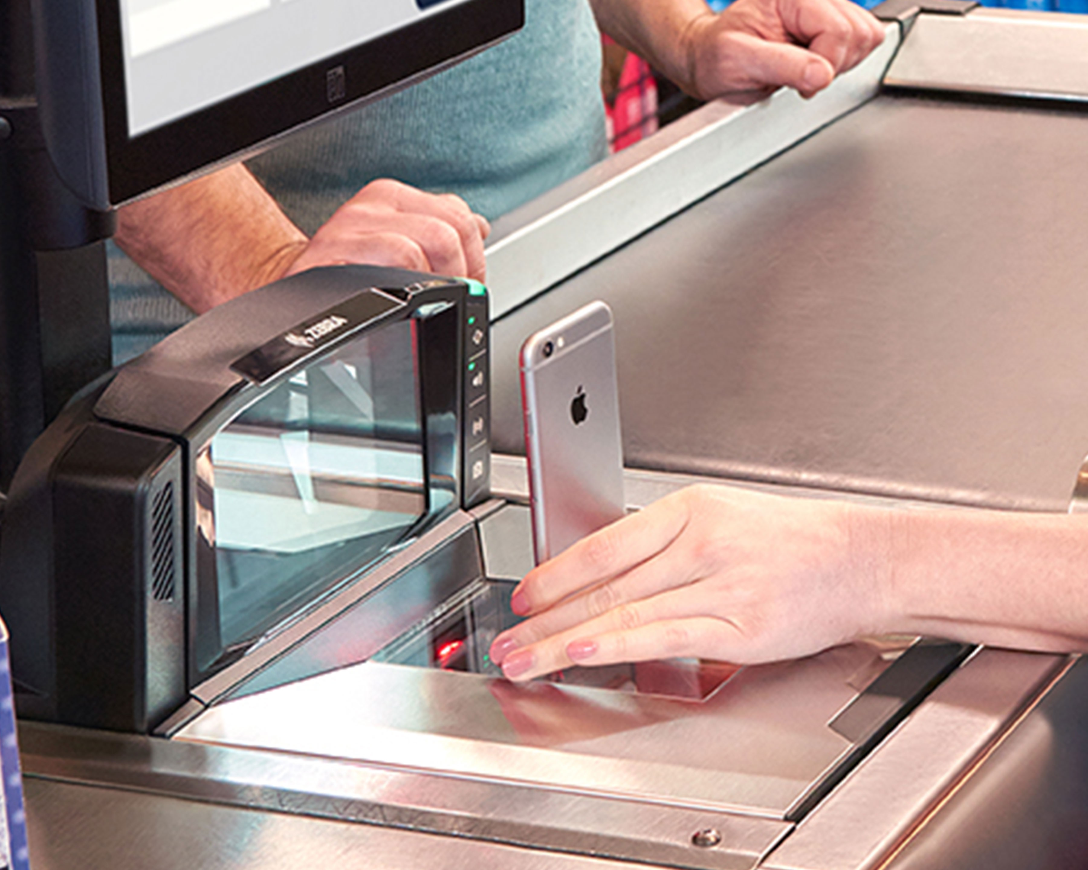 Grocery store cashier uses Zebra MP7000 scale scanner to scan the screen of a mobile phone