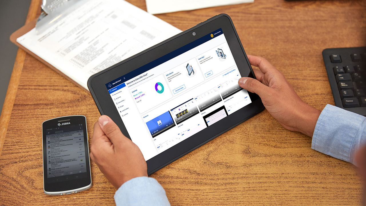 A person looking at the Zebra DNA Cloud dashboard on the Zebra ET51 tablet.