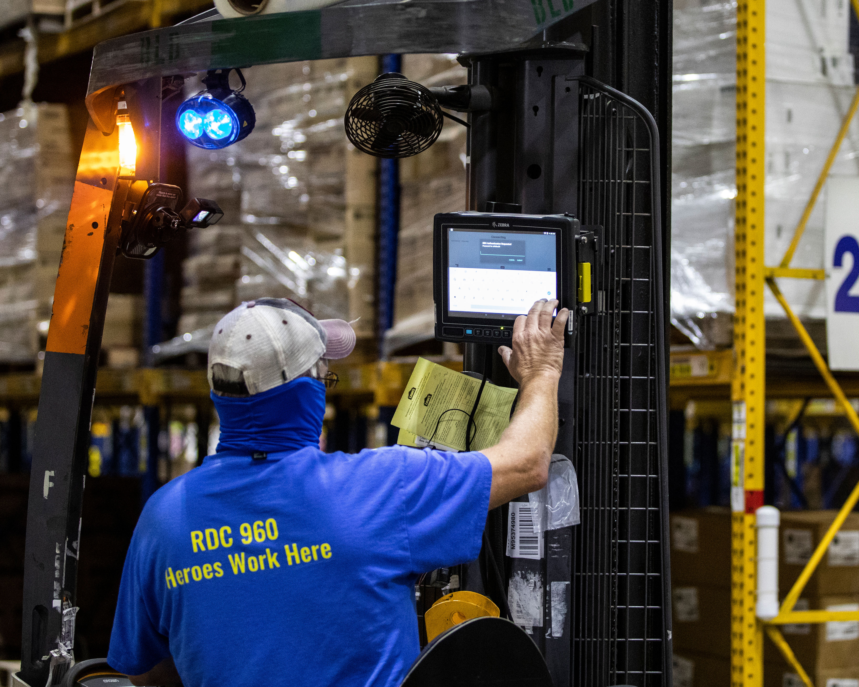 VC80x App Warehouse Lowes 5x4 3600 Zebra VC80x mobile computer mounted to a warehouse vehicle is being used by a Lowe's employee to enter his password for access