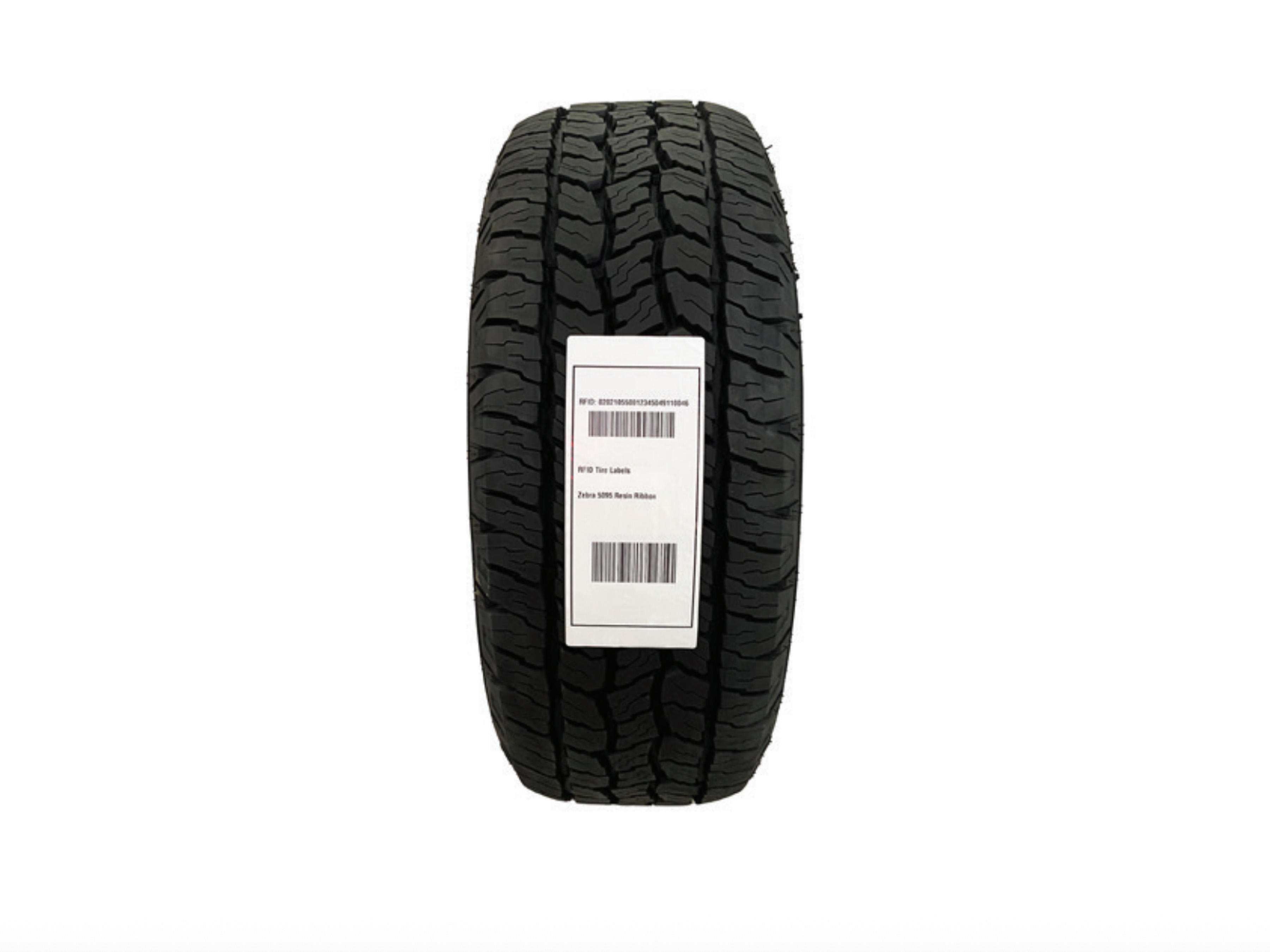 A tire thread label is adhering to thread of a rubber tire.
