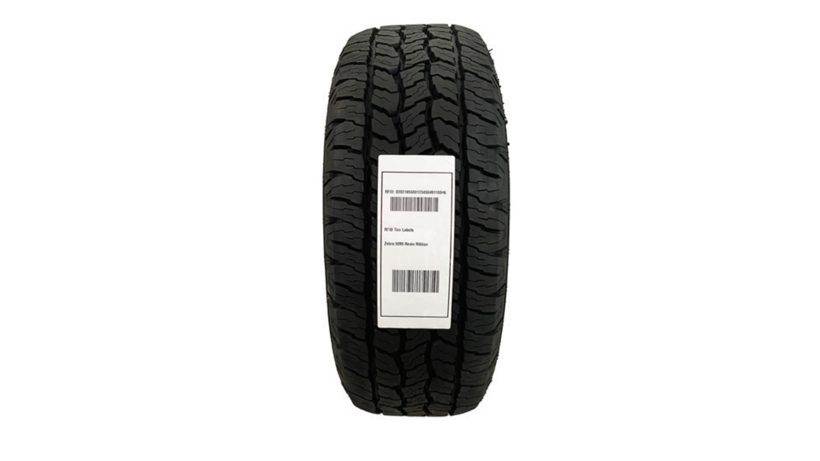 A tire with a tire thread label affixed to its tread.