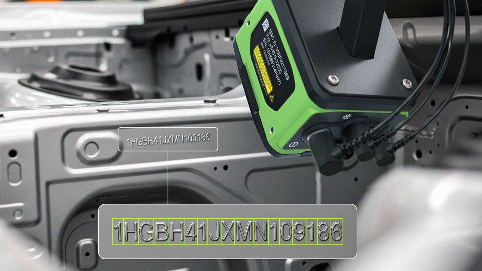A Zebra VS40 Smart Camera inspects and decodes a Vehicle Identification Number (VIN) stamped directly on a car chassis during the manufacturing process