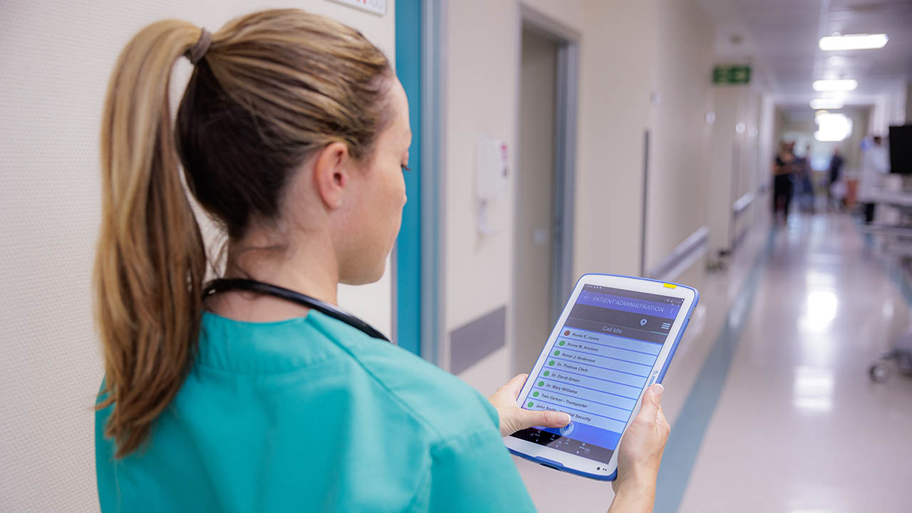 A nurse calls for assistance using Workforce Connect on her Zebra healthcare tablet