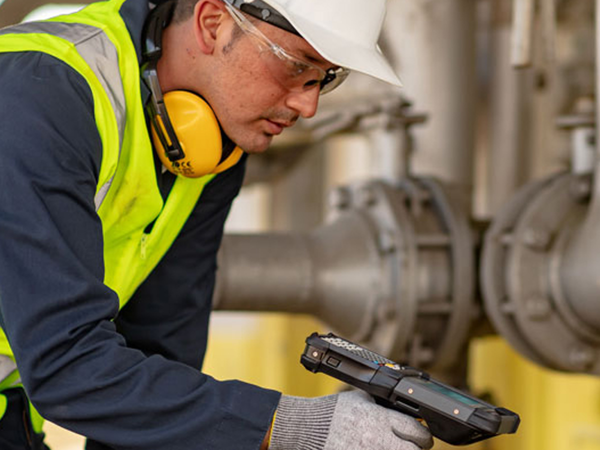 Utilities Workers holding a zebra mobile computer