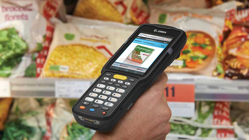 Mobile computer being used to scan items in a grocery store