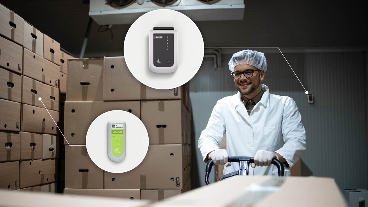 A cold chain warehouse worker moves boxes in a freezer