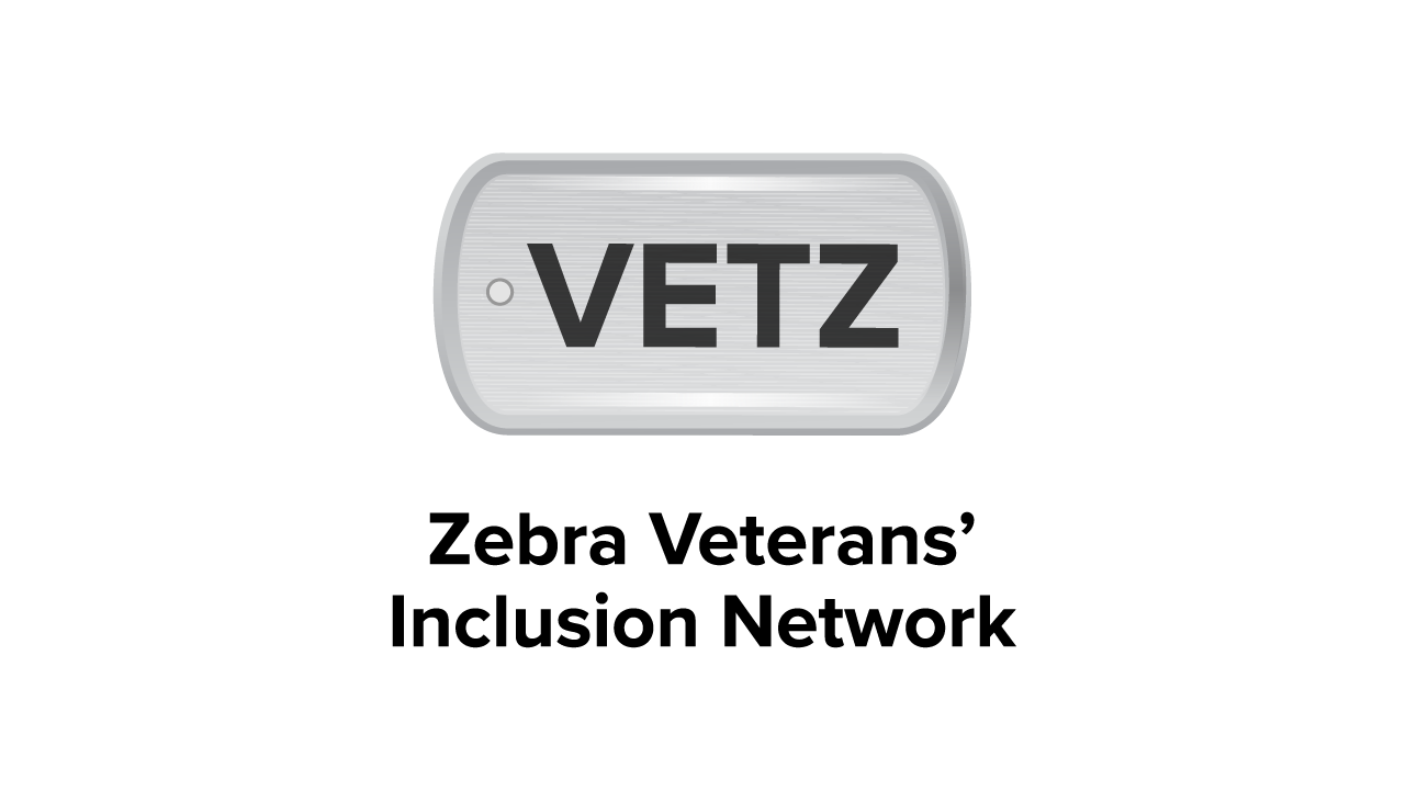 A dog tag that says "VETZ." Underneath, Zebra Veterans' Inclusion Network.