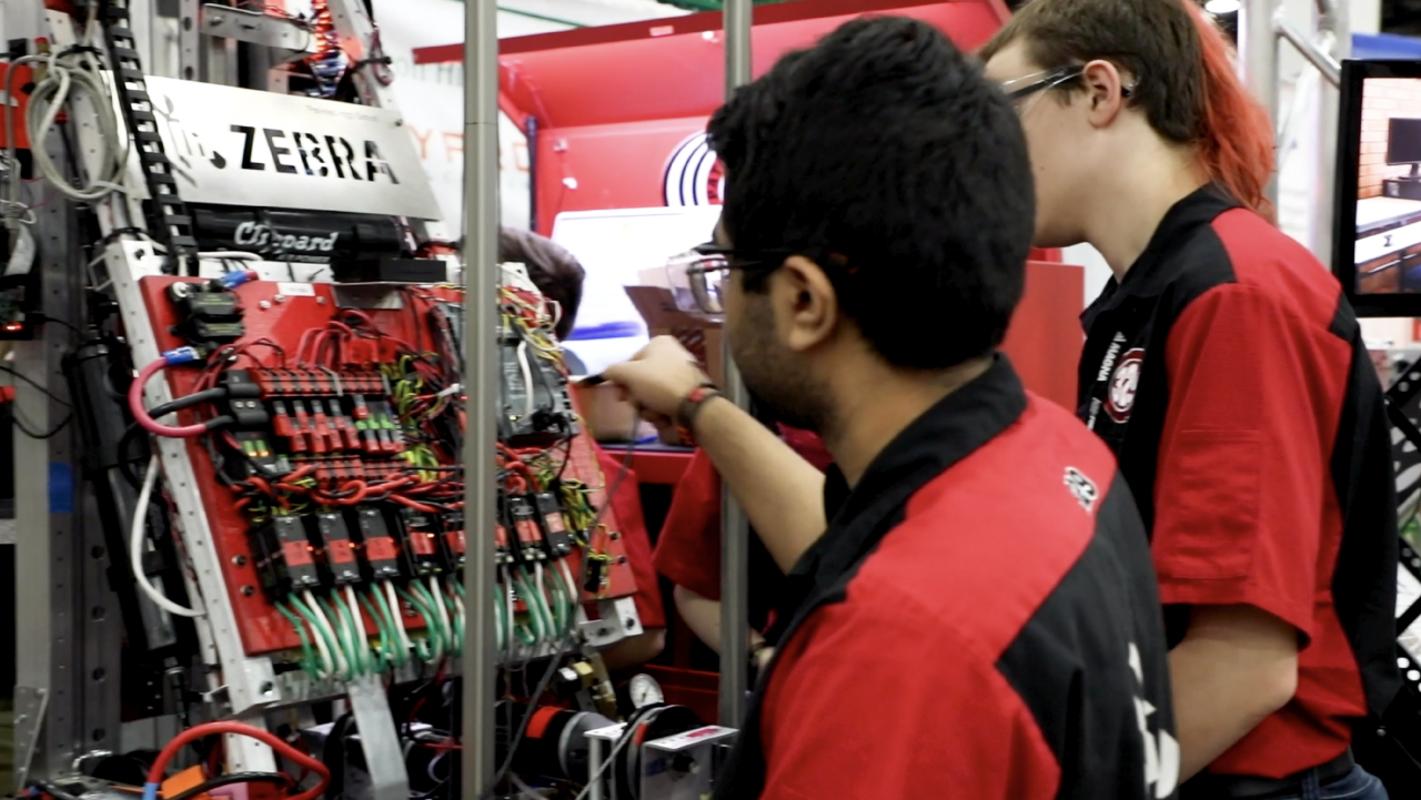 Students use Zebra technologies during a FIRST Robotics competition