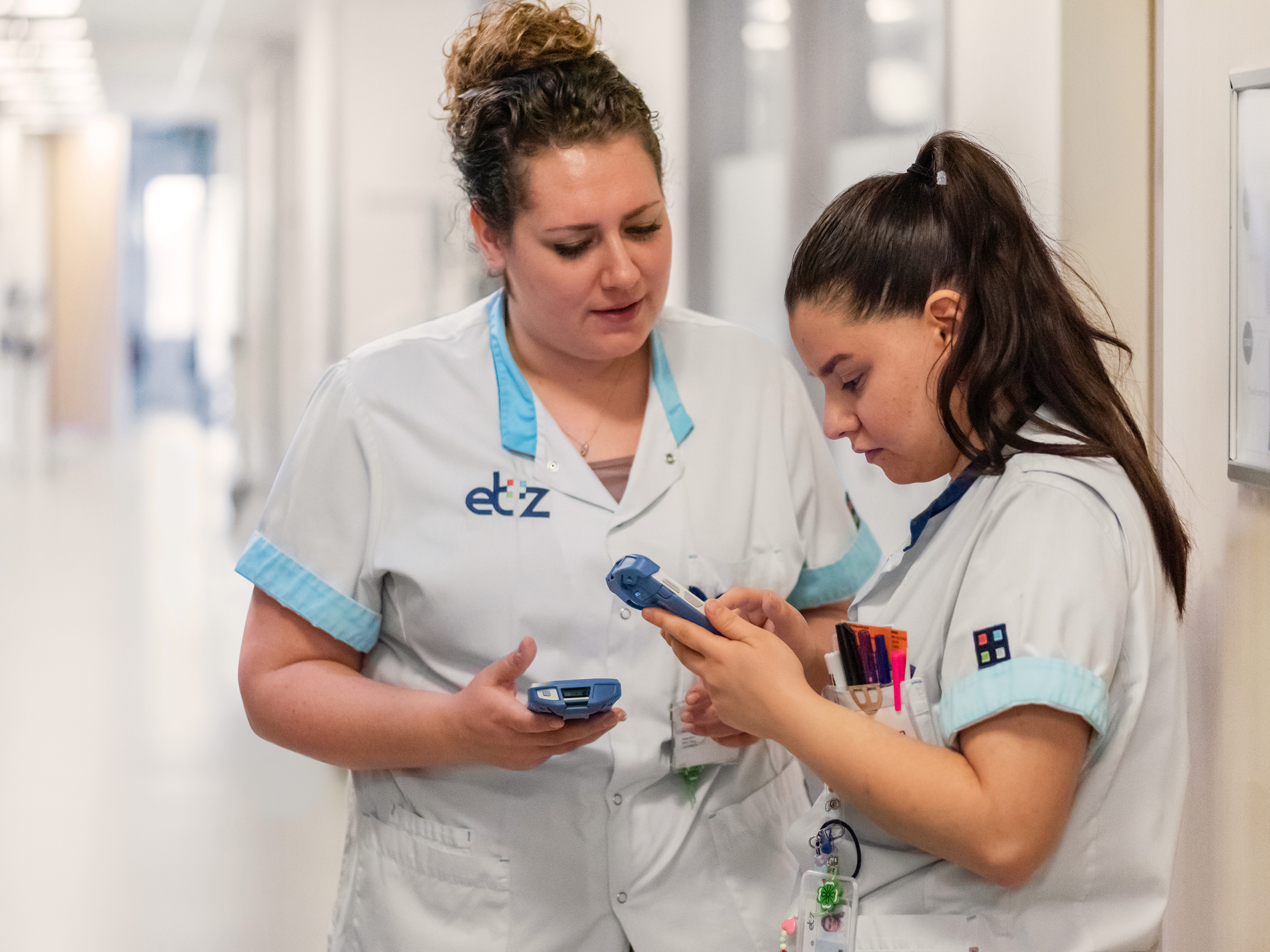 Healthcare Nurses Interacting in Hallway with TC52-HC 4:3