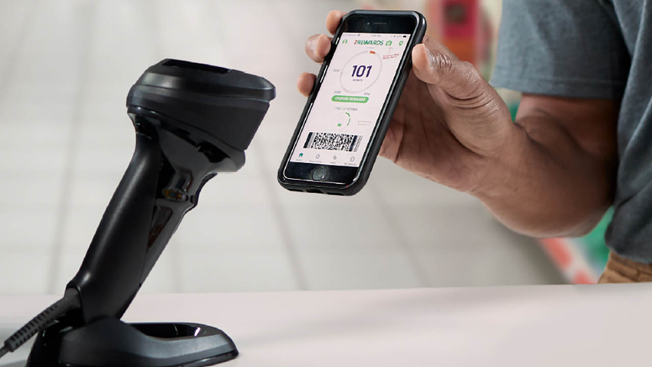 A barcode scanner is used to accept contactless payment from a customer's smartphone