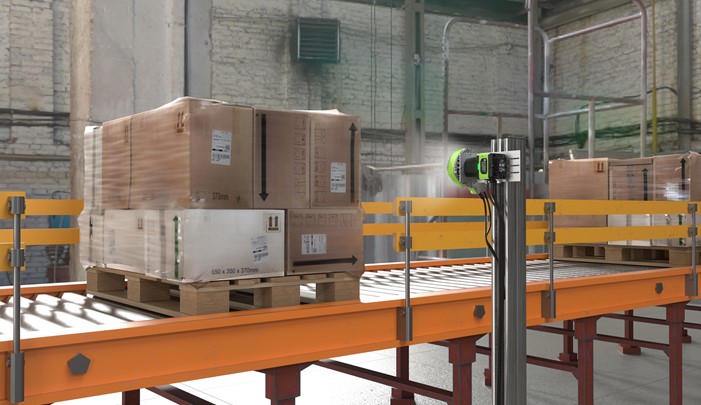 A number of parcels on a warehouse pallet being scanned by a fixed scanner using machine vision.