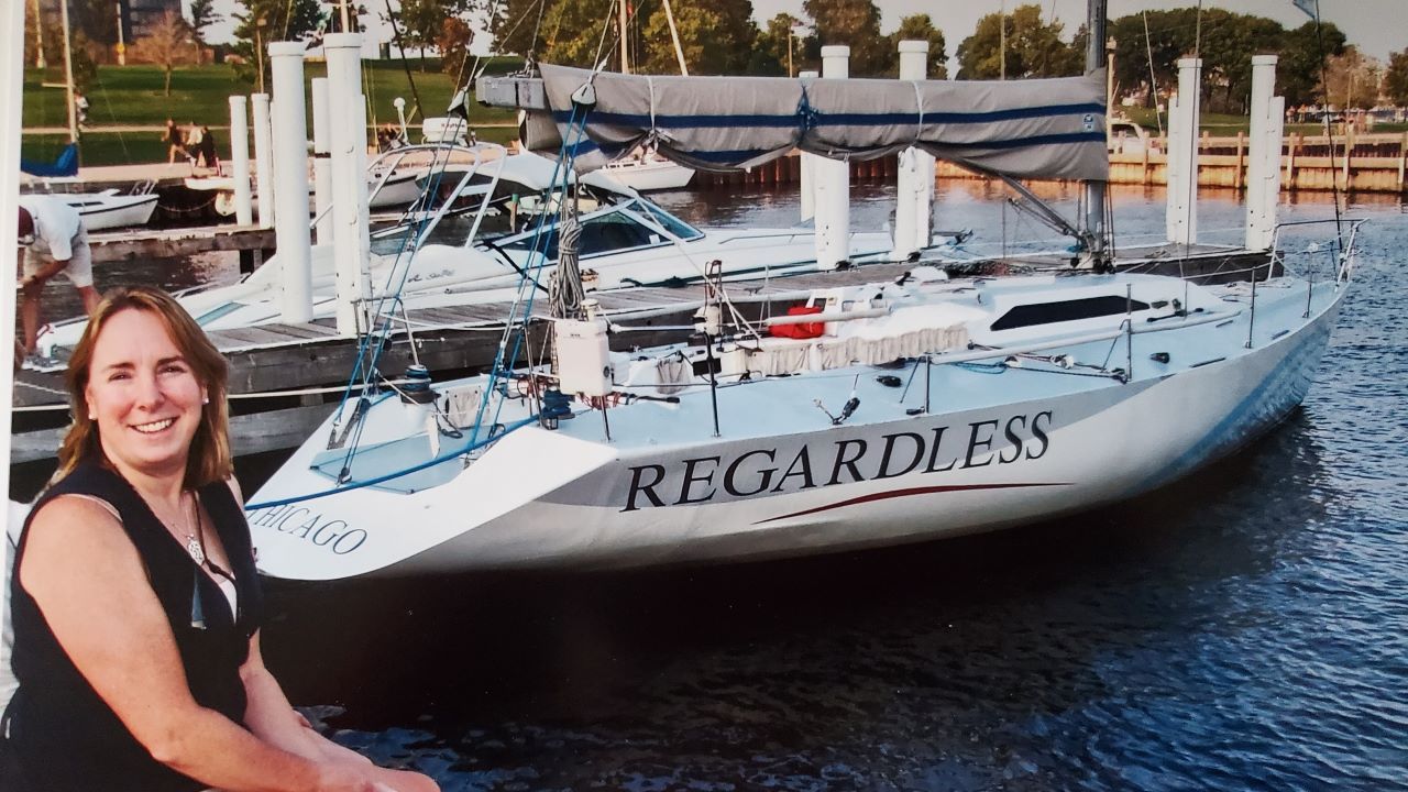 Linda Hanks sit on the dock at the marina