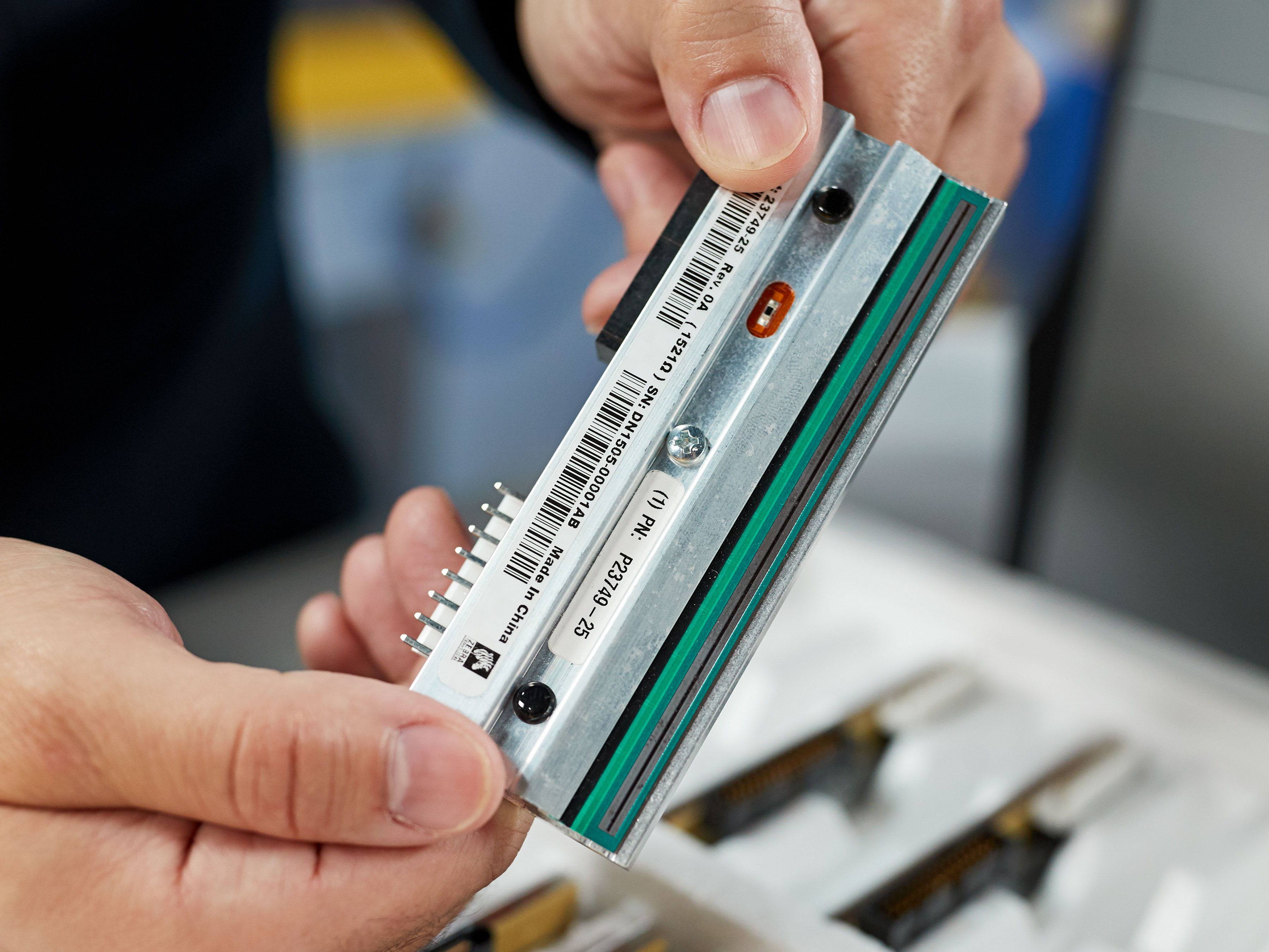 View of specialty paper label being applied to electronics