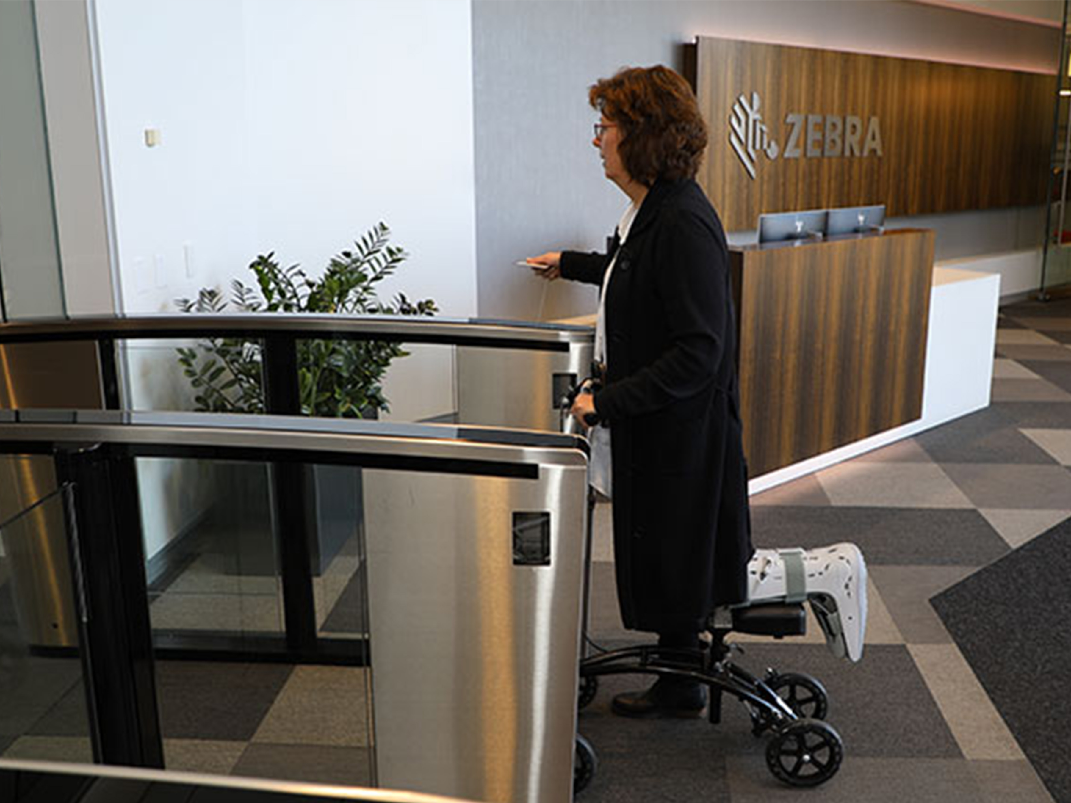 Person moving through Zebra Workplace Accommodations Entryway