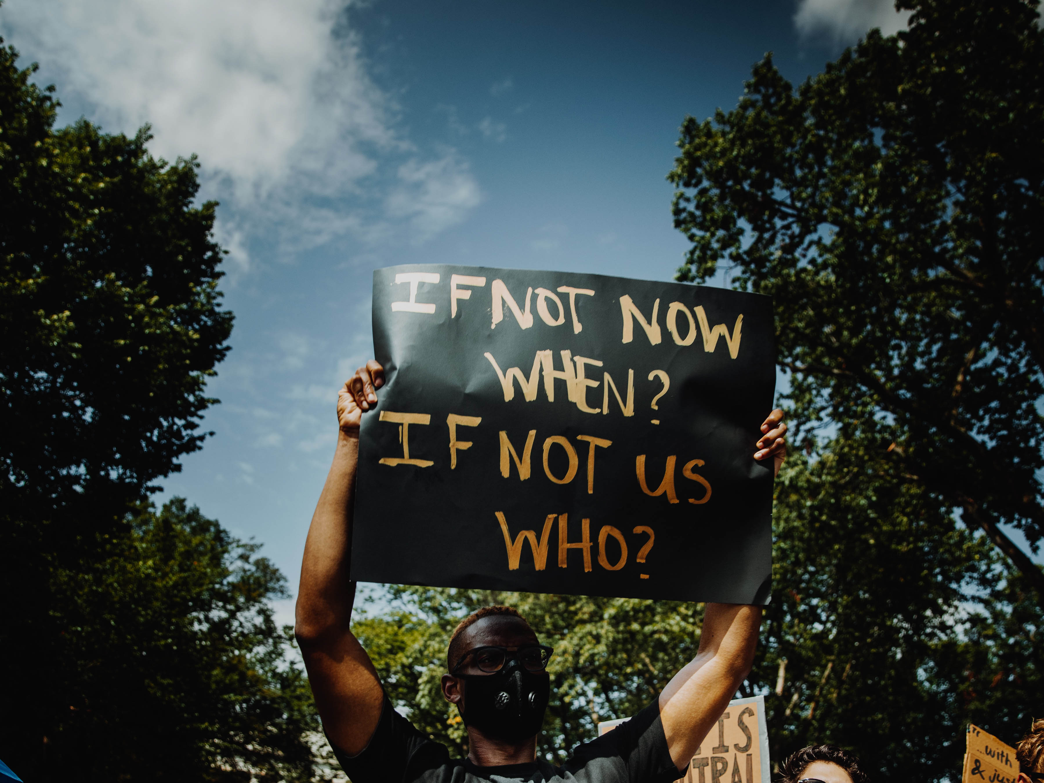 People at a march holding signs