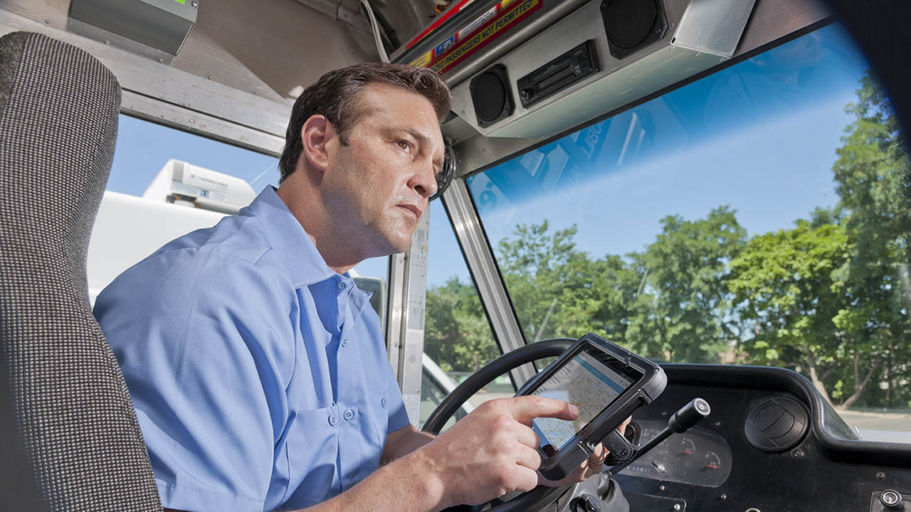 A delivery driver looks at his ET5x rugged tablet