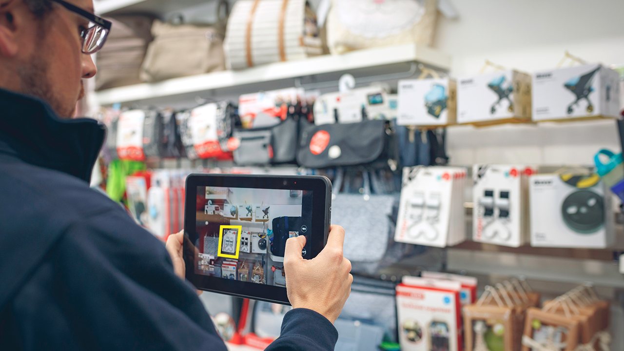 An ET5x rugged tablet is used to take a picture of shelf inventory