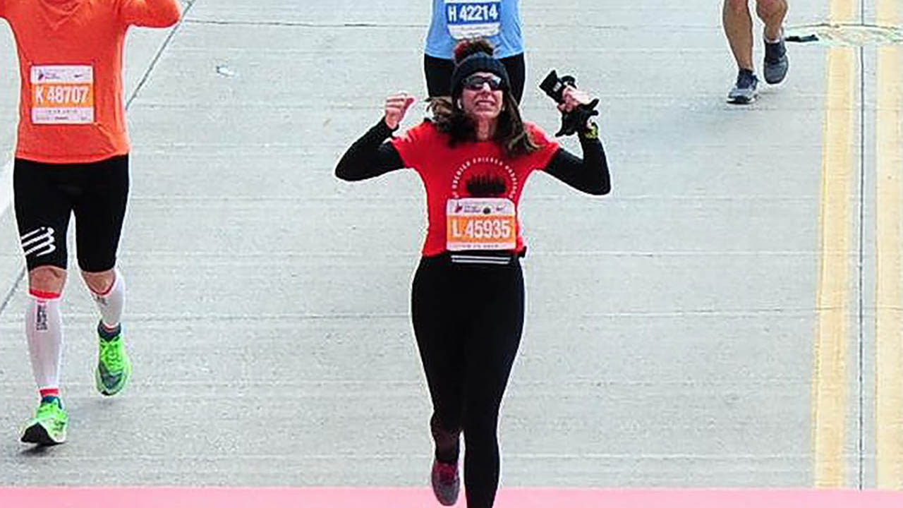 Lisa Cowgill crosses the finish line at a recent Chicago Marathon