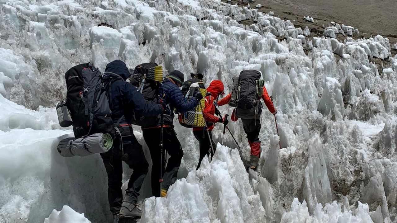 The Three Amigos make their way through ice as they continue their ascent up Mount Aconcagua alongside their guide.