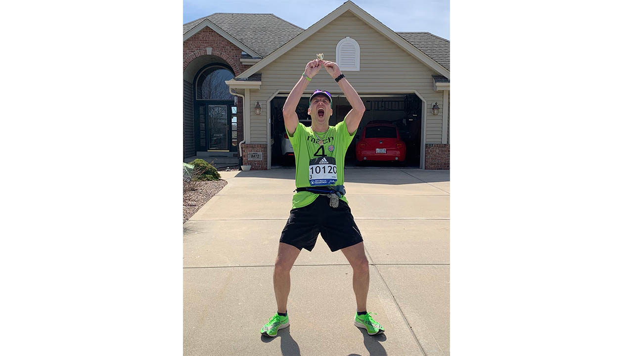 Joe Zons celebrates after finishing the DIY marathon he ran after the 2020 Boston Marathon was canceled.