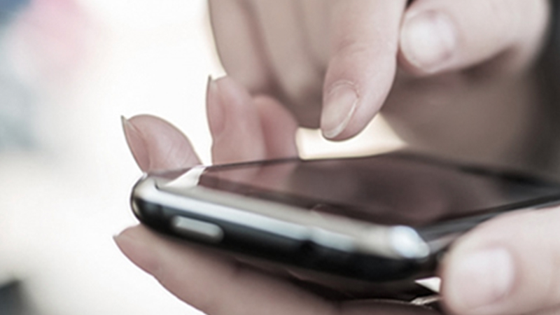 A closeup shot of a worker using the Zebra TC5x touch mobile computer.