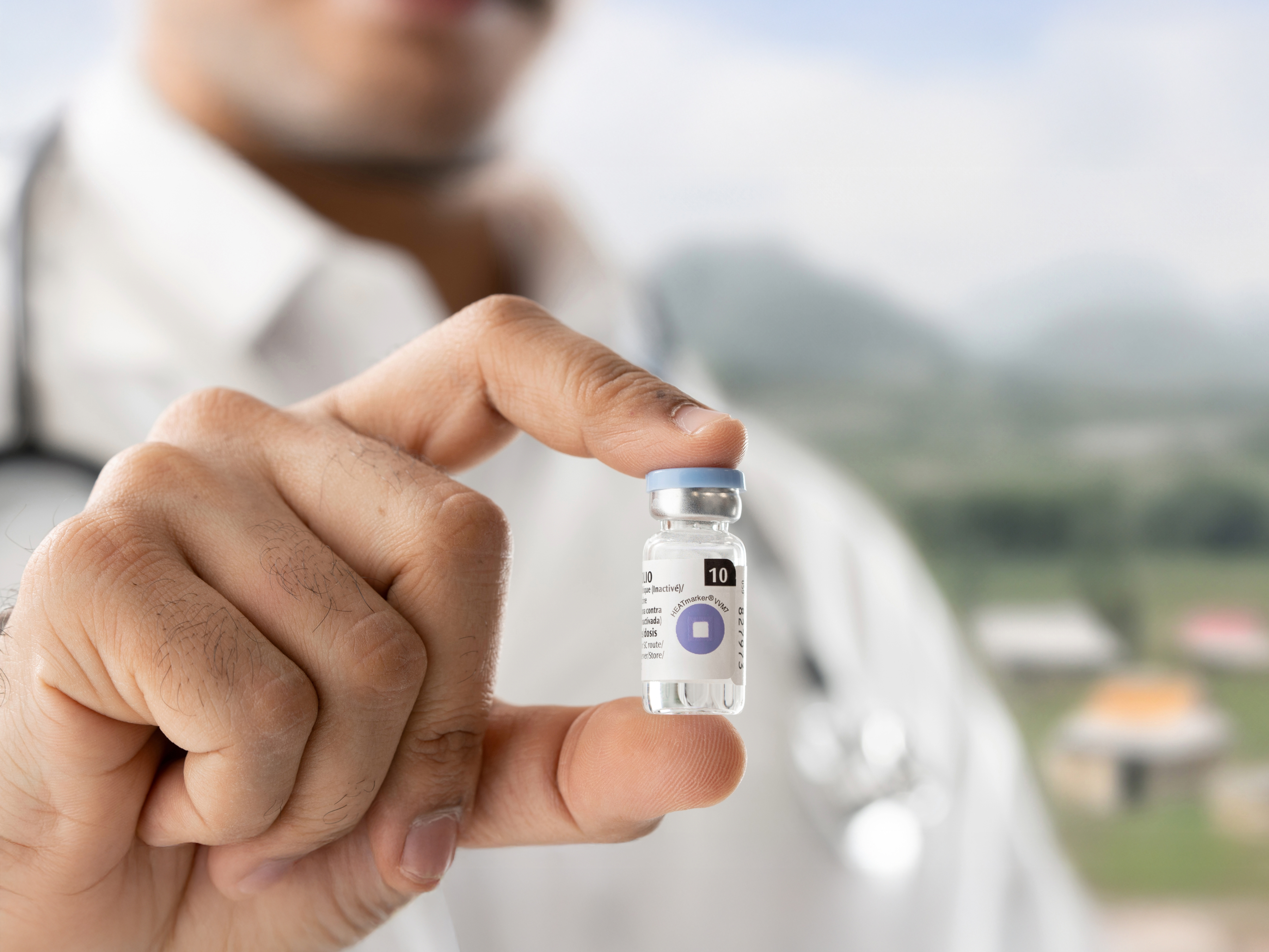 Close-up shot of Zebra Temperature Monitoring being held by a doctor