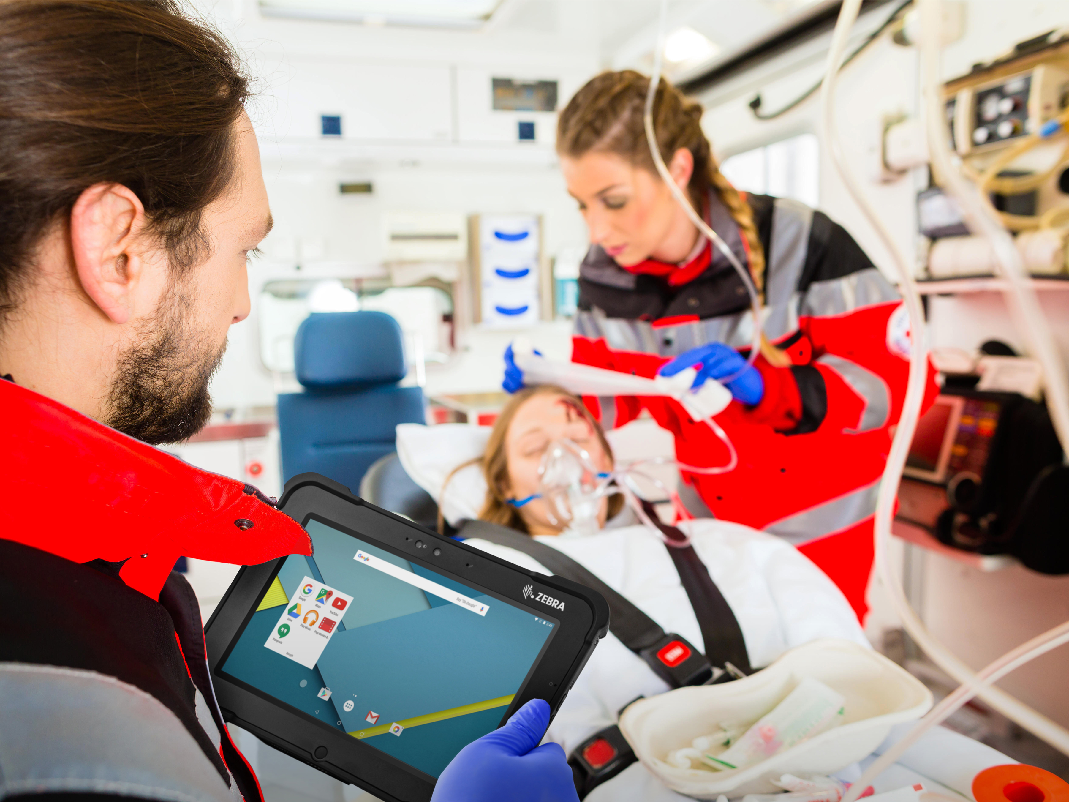 public sector photography website ambulance vechicle paramedics seeing to patient