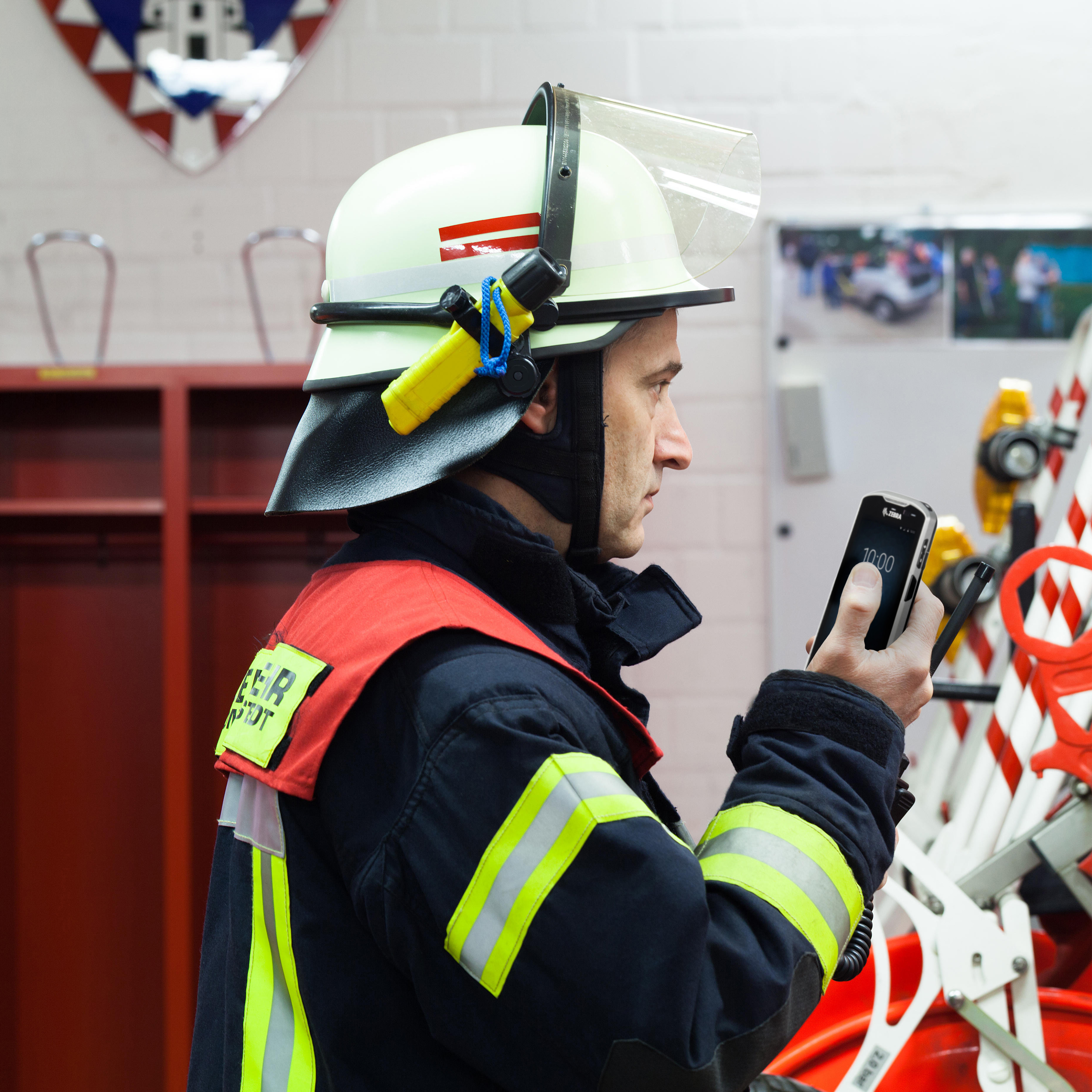 public sector photography website fire officer side talking handheld