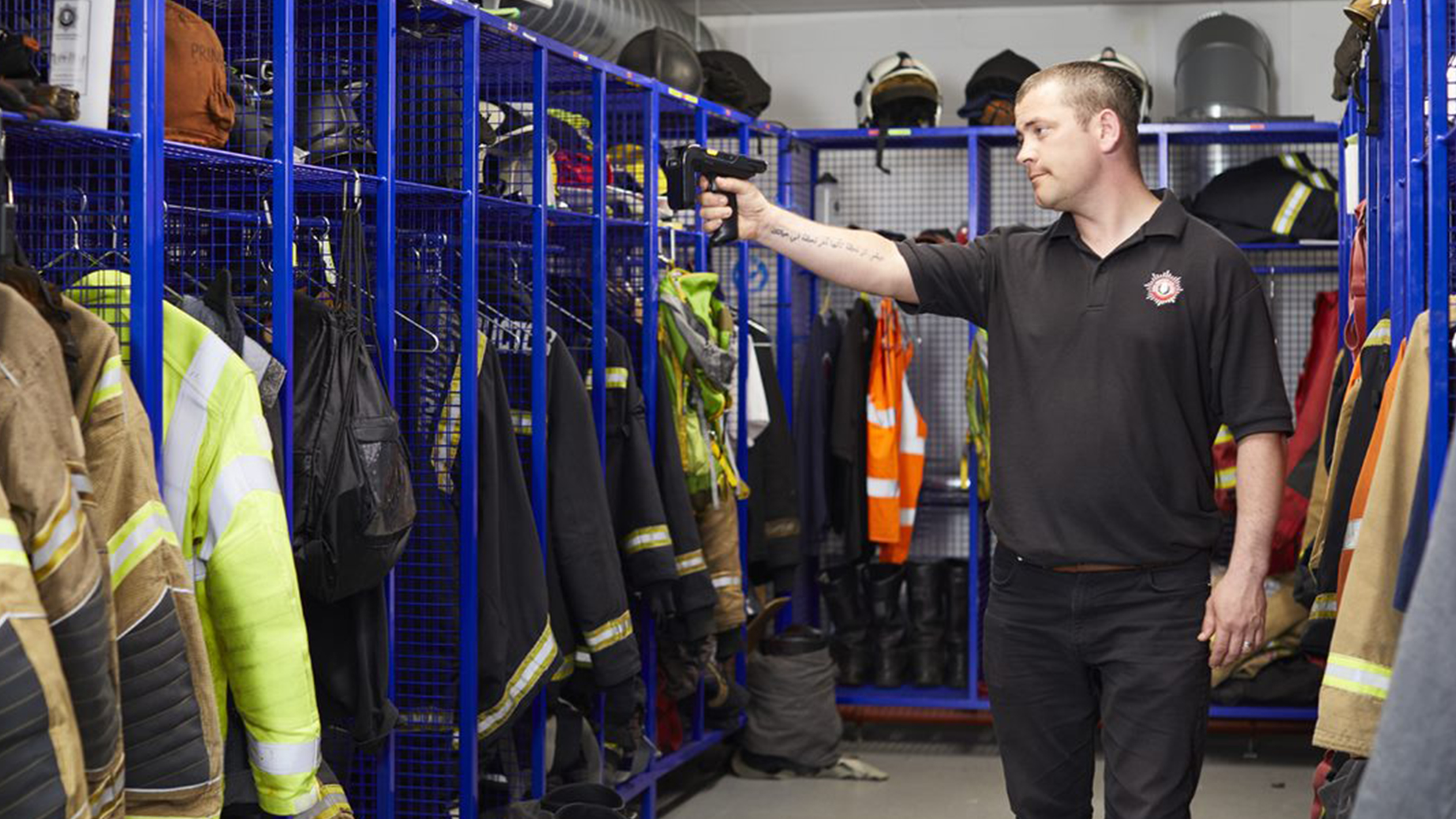 public sector photography website fire stock taking pointing down uniform shelf