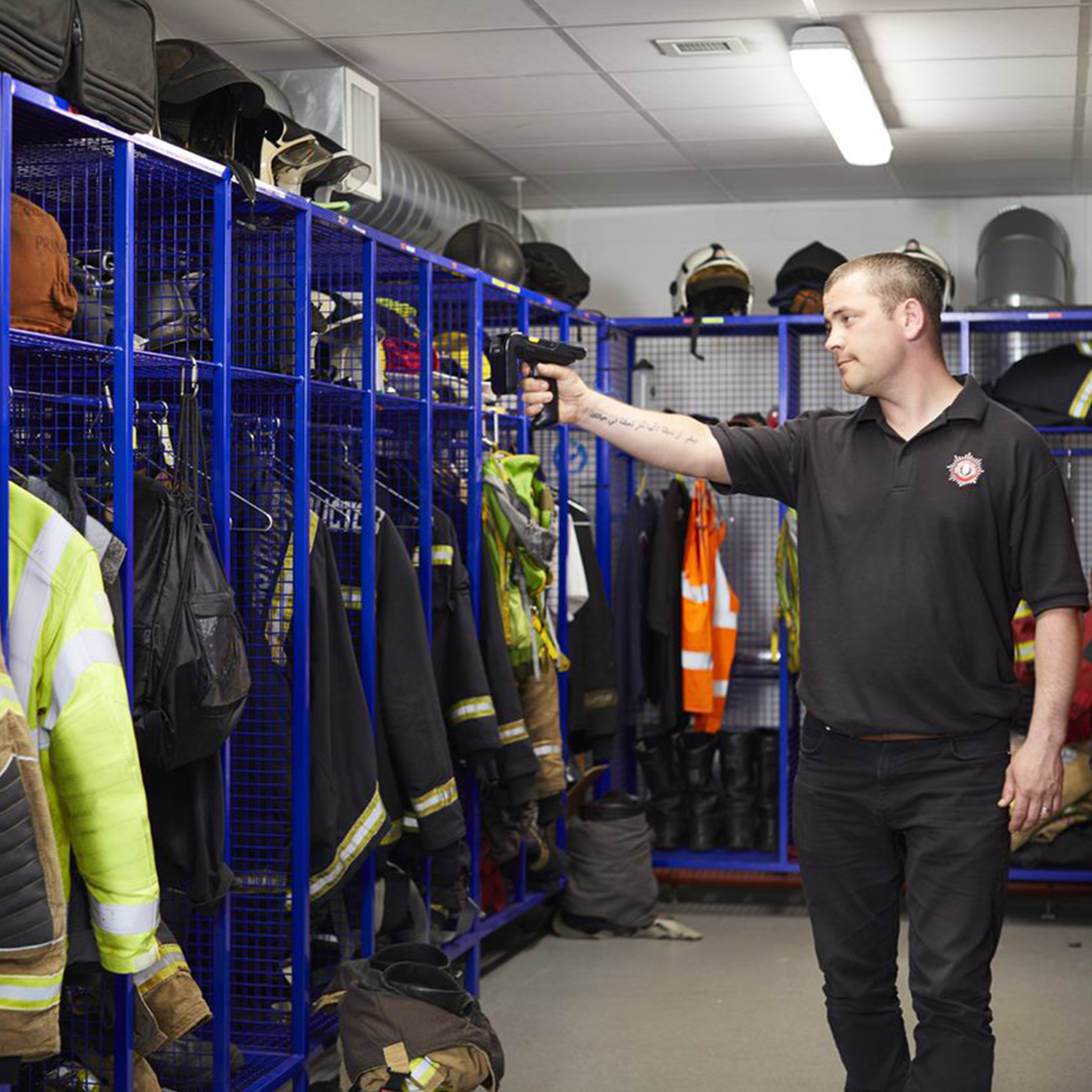 public sector photography website fire stock taking pointing down uniform shelf